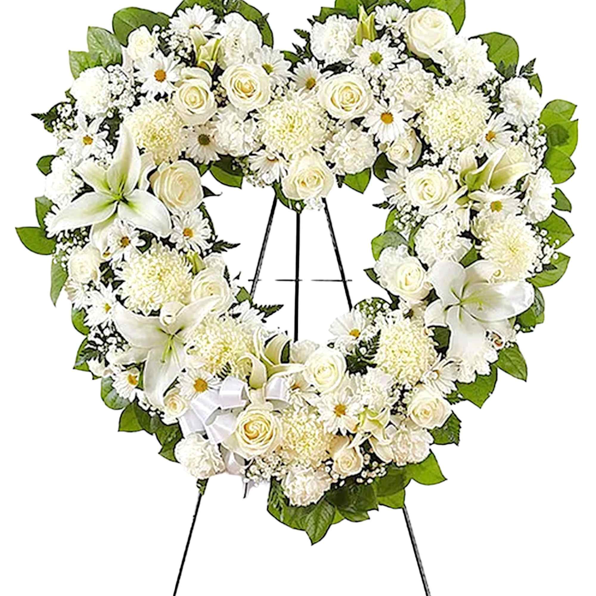 Heart-shaped white floral wreath on a standing easel