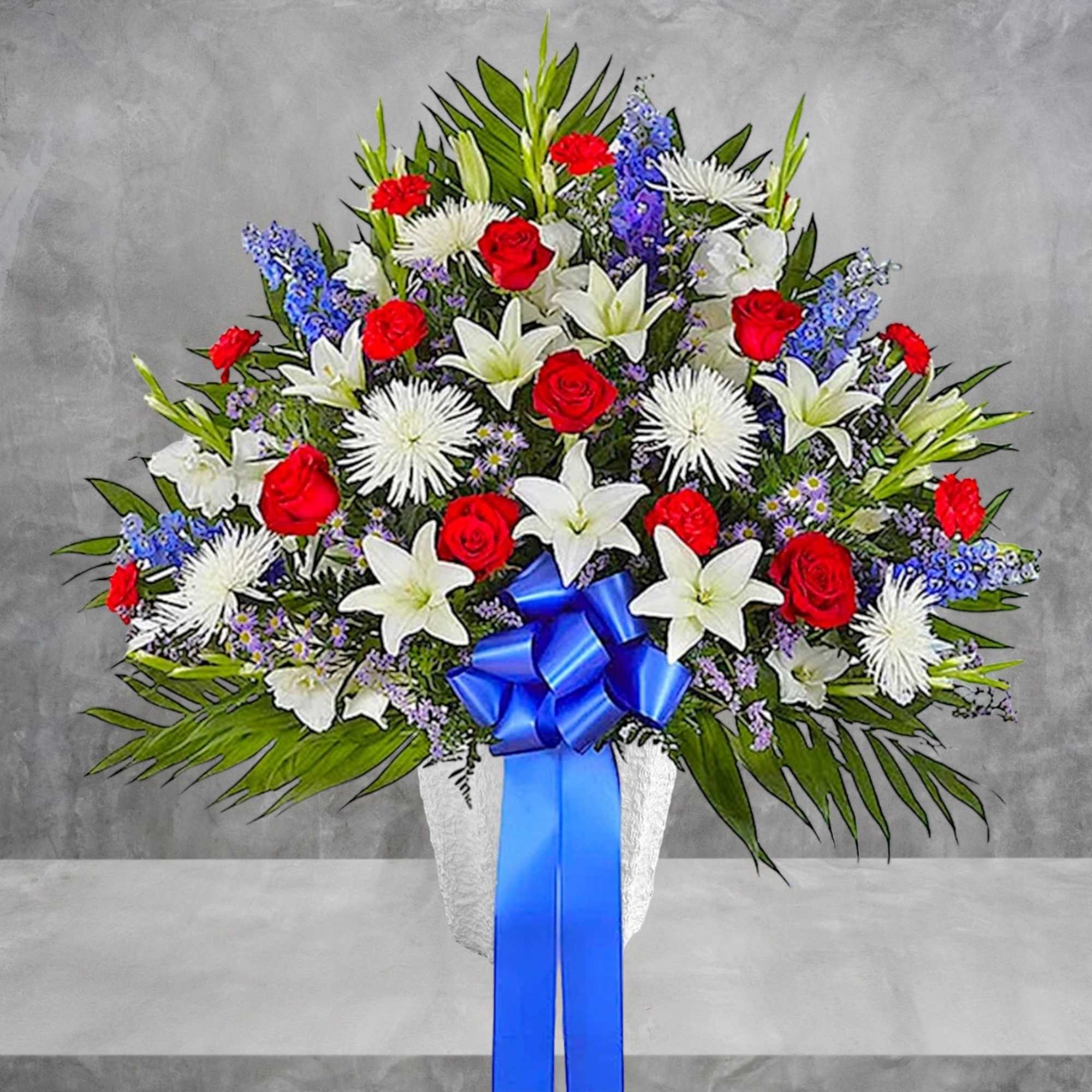 Large bouquet of red roses, white lilies, and blue flowers with a blue ribbon, photo 4 of 6