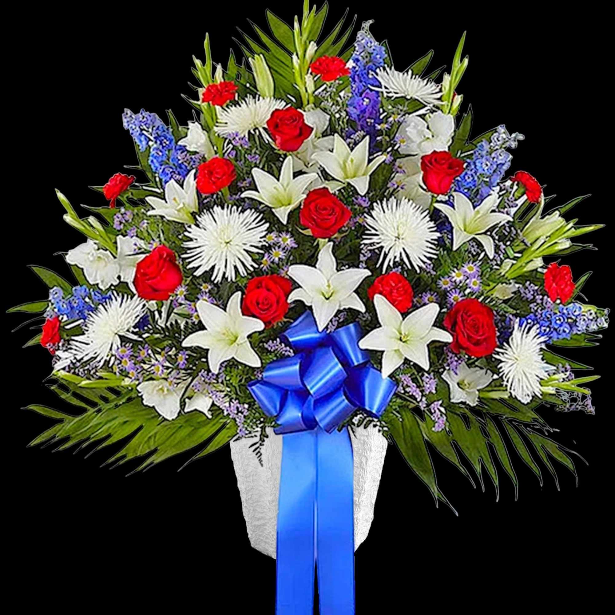 Red roses and white lilies in a white vase with a blue ribbon