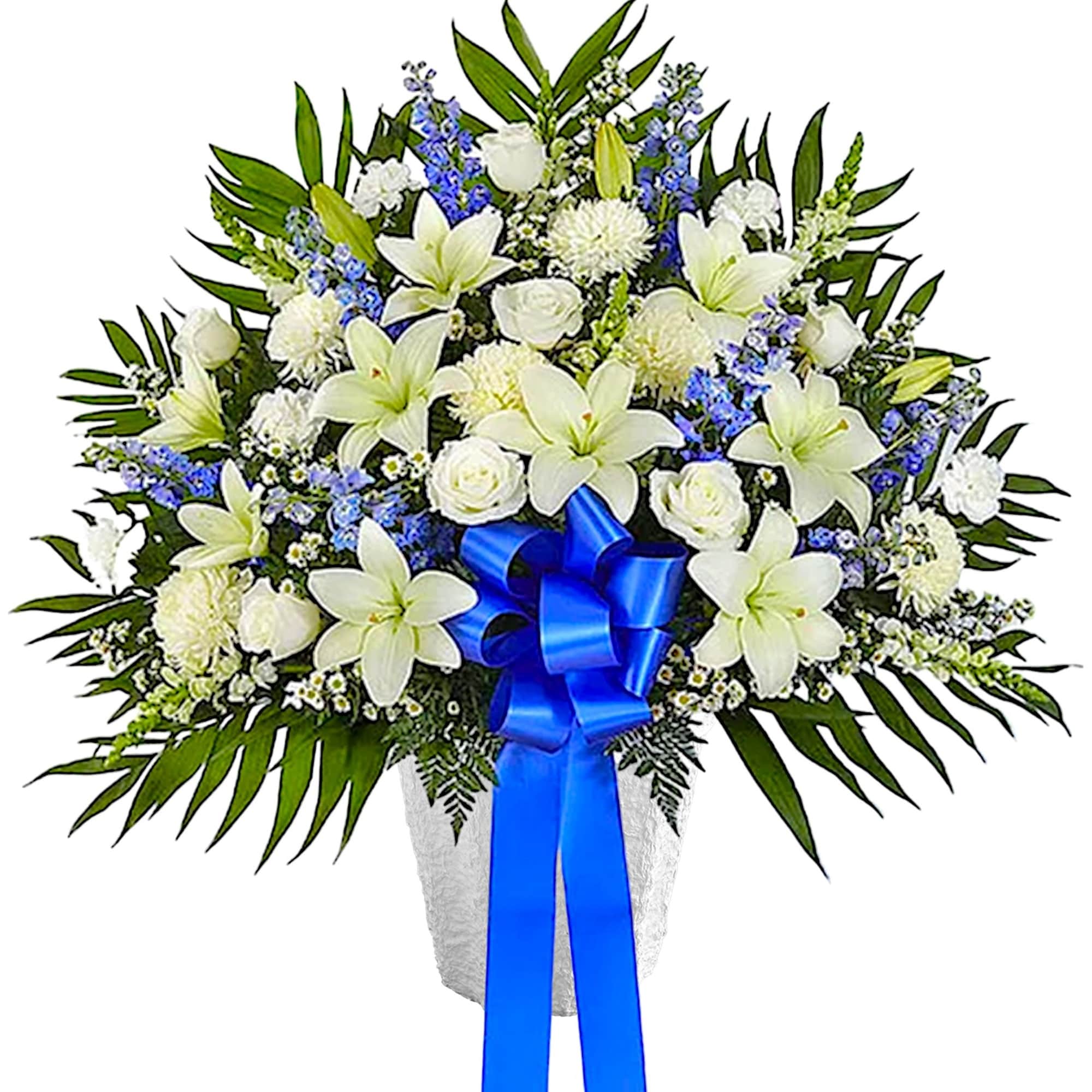 White floral spray with blue ribbon in a white container