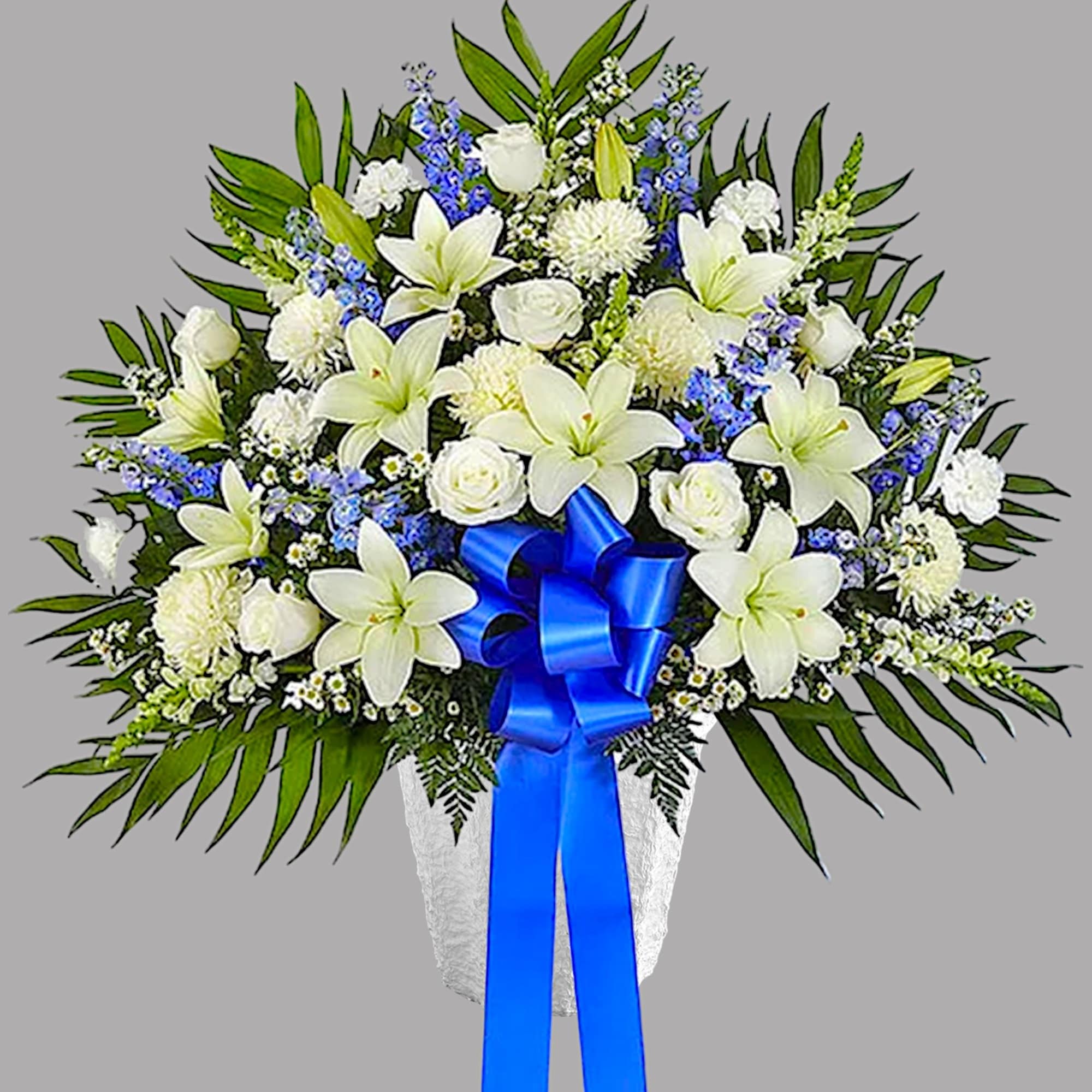 White lilies and roses in a white vase with a blue ribbon, photo 6 of 6