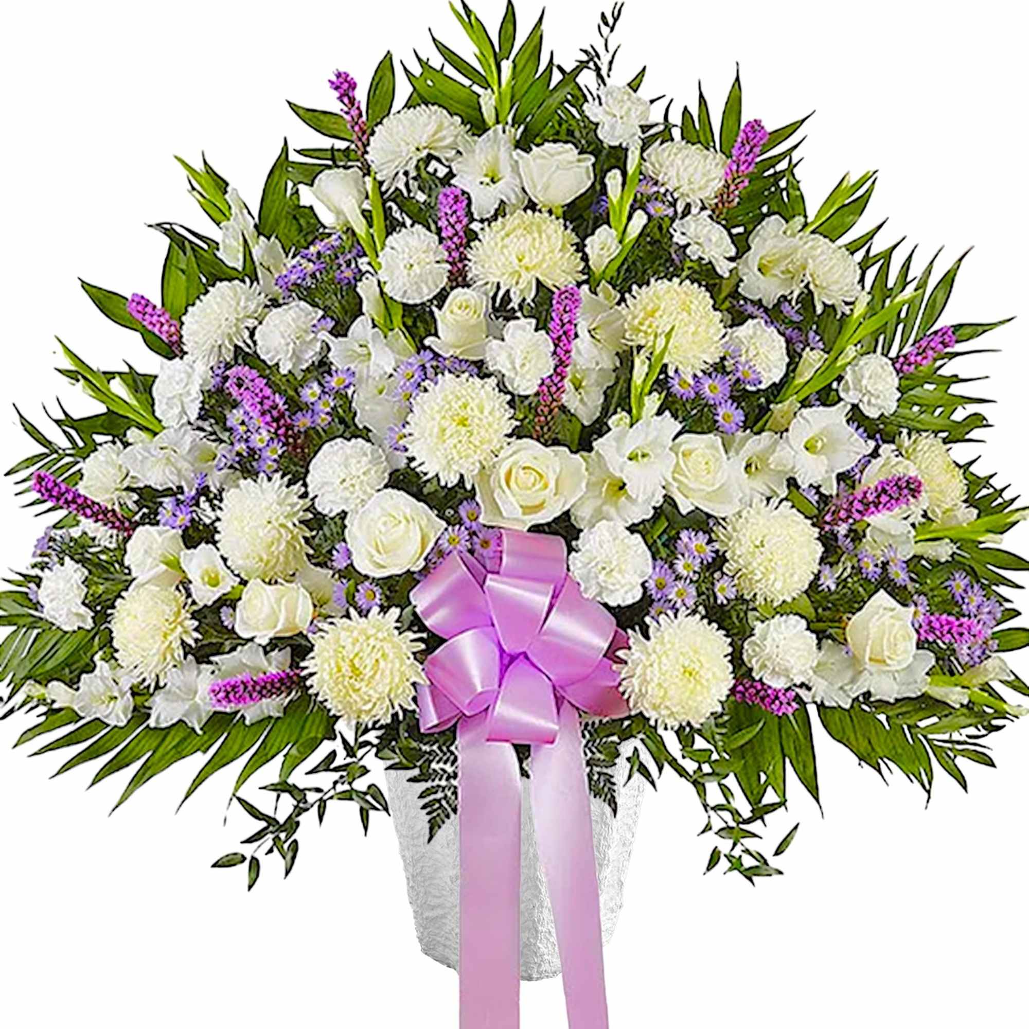 White floral spray with a pink ribbon in a vase