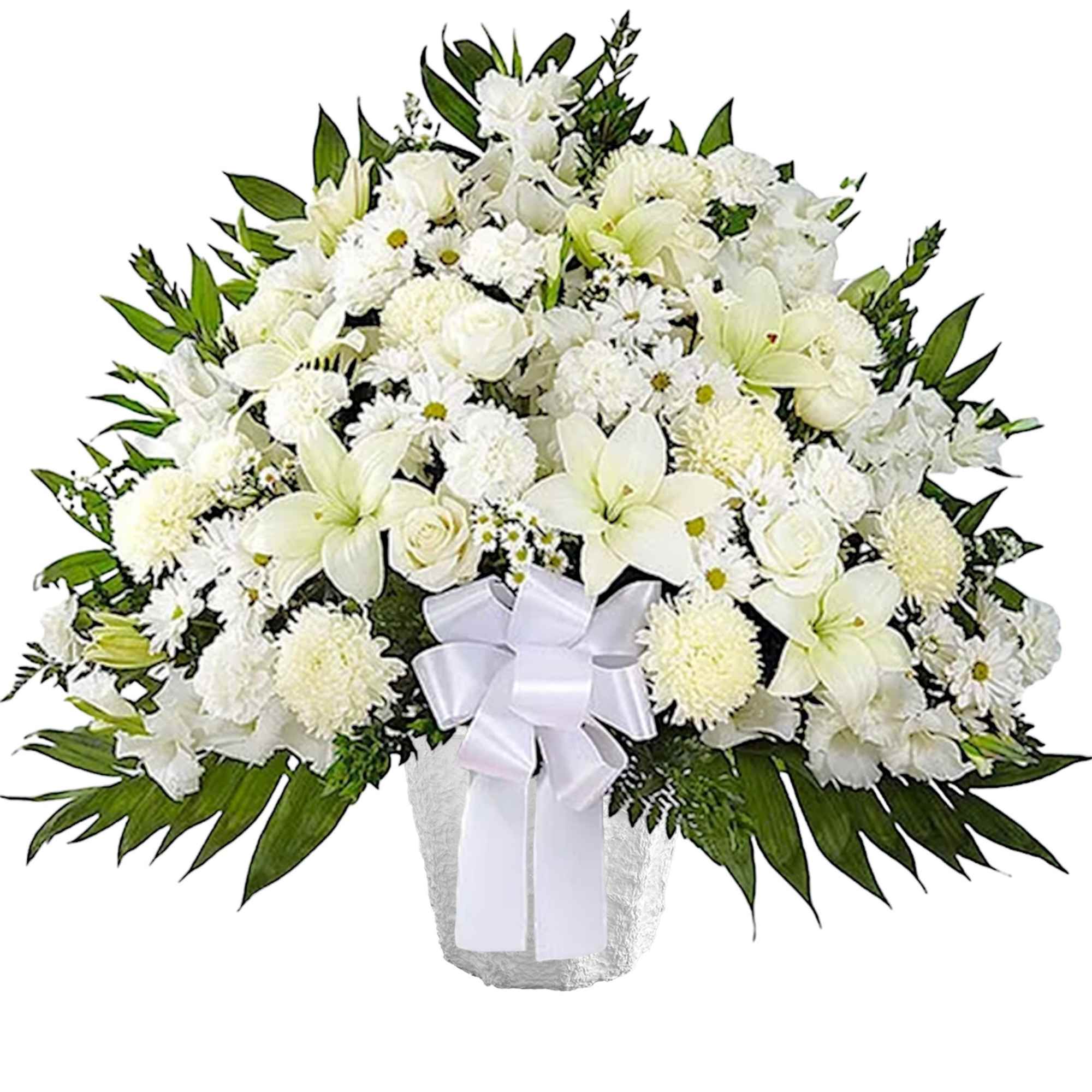 White floral spray in a vase with a white ribbon