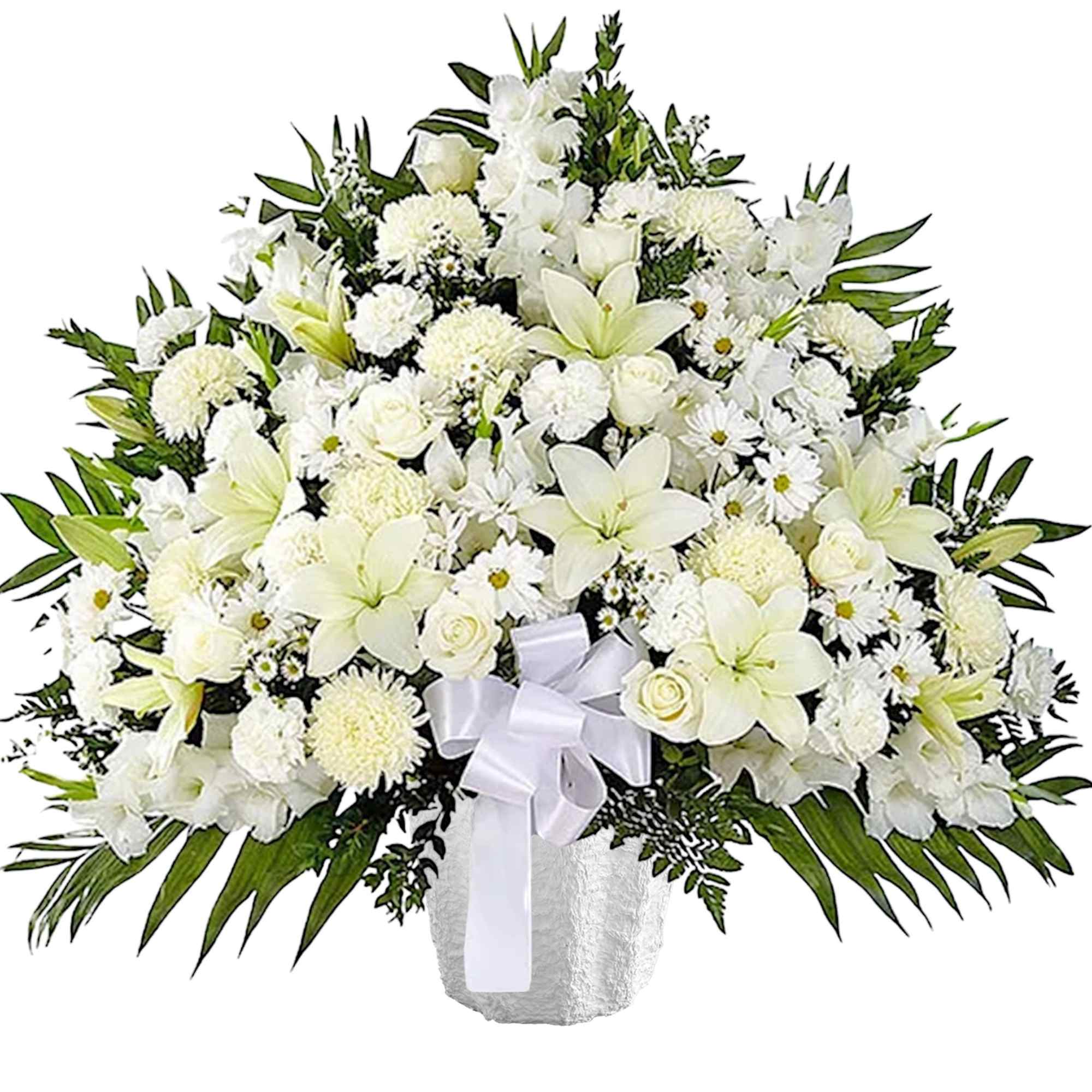 White floral arrangement in a textured vase with a white ribbon