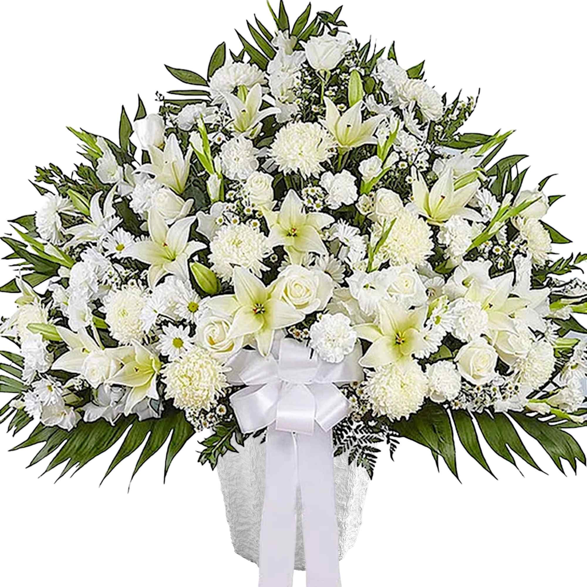 White funeral spray with lilies, roses, and chrysanthemums in a vase