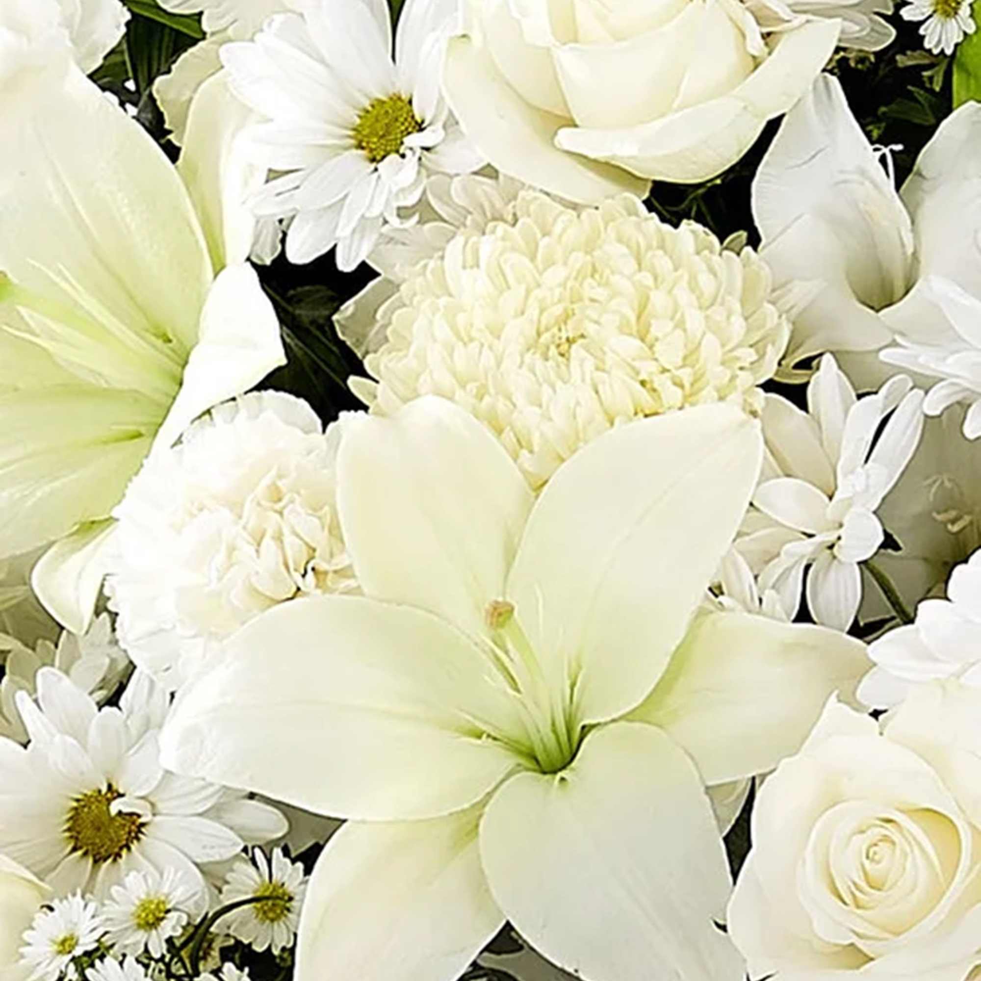 White floral bouquet with roses, daisies, and large lily blooms