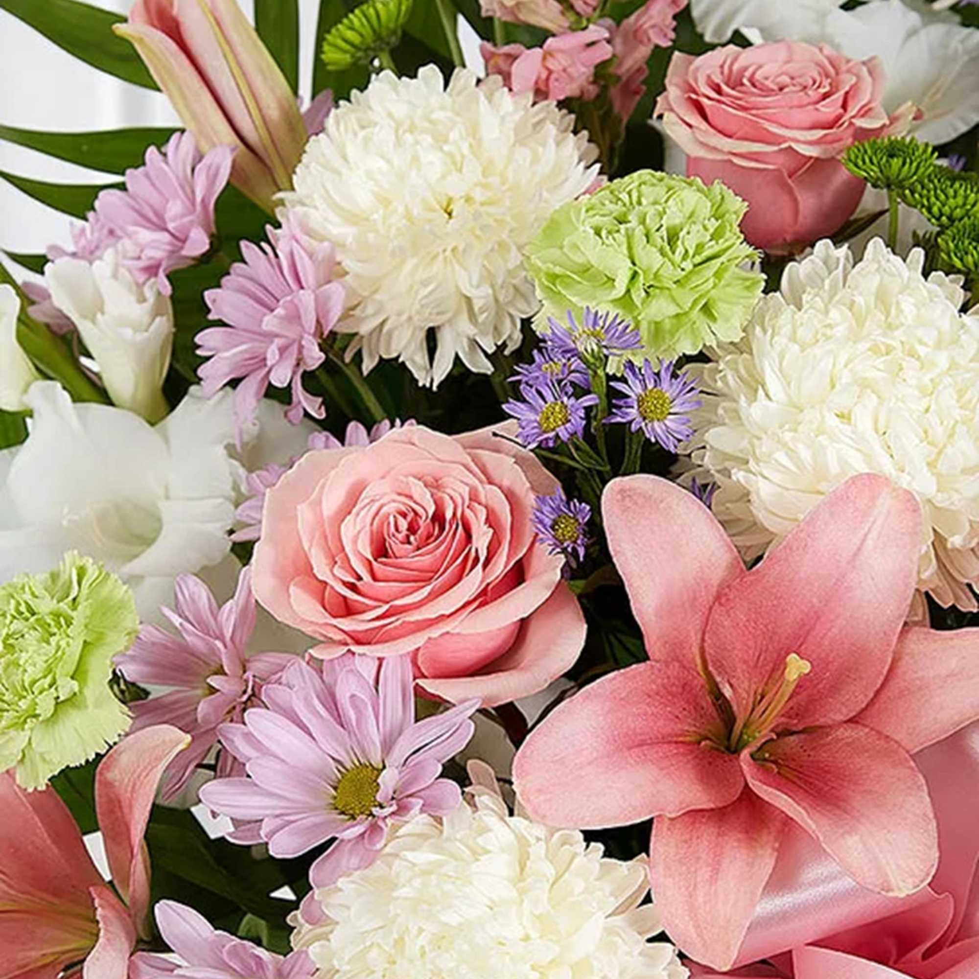 Mixed bouquet with pink lilies, roses, and white chrysanthemums