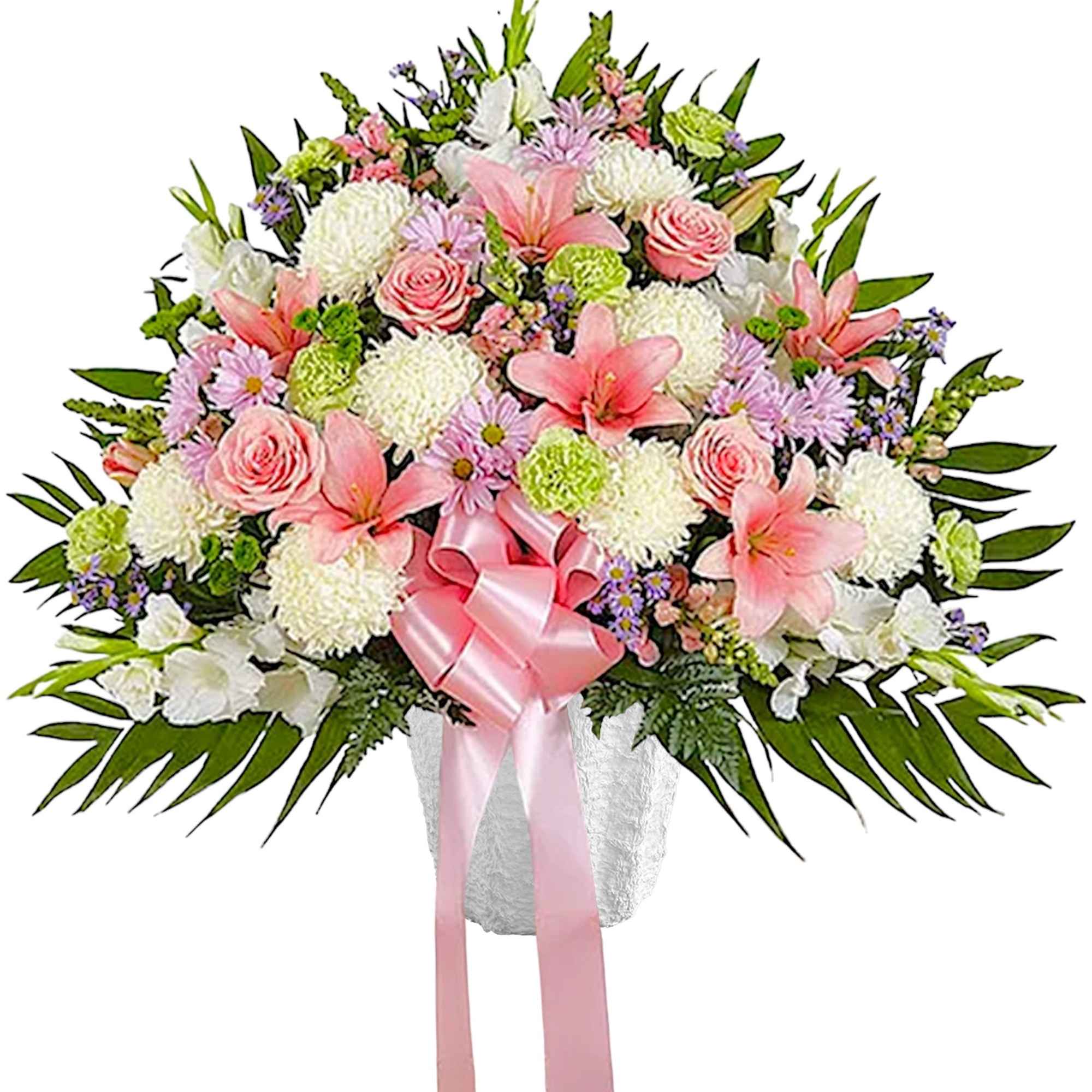 Pink and white floral arrangement with a pink ribbon in a vase