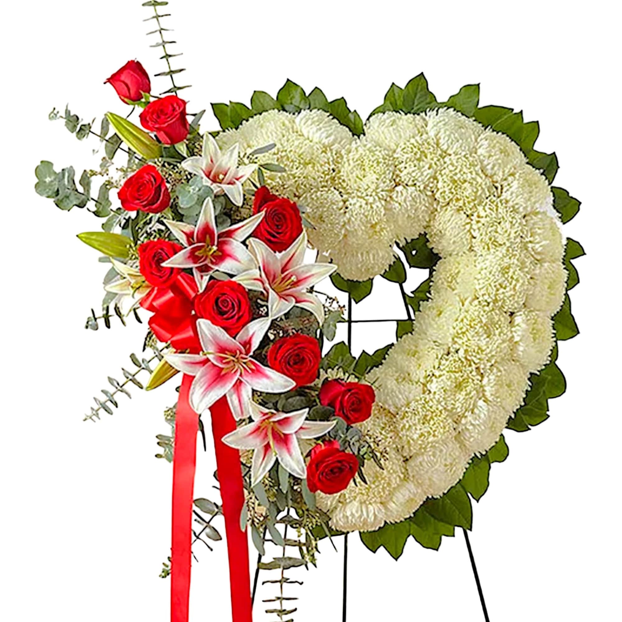 Heart-shaped funeral wreath with white chrysanthemums and red roses