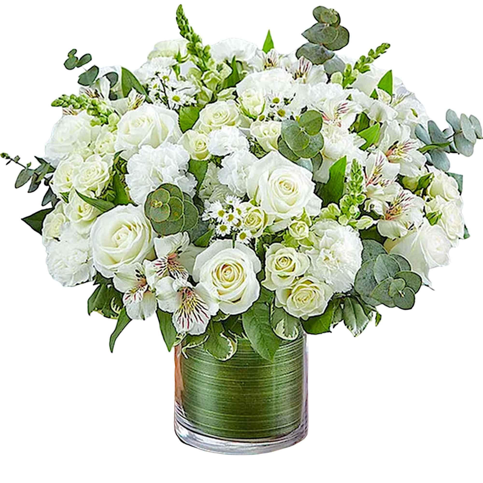 White rose bouquet in a glass vase with green foliage