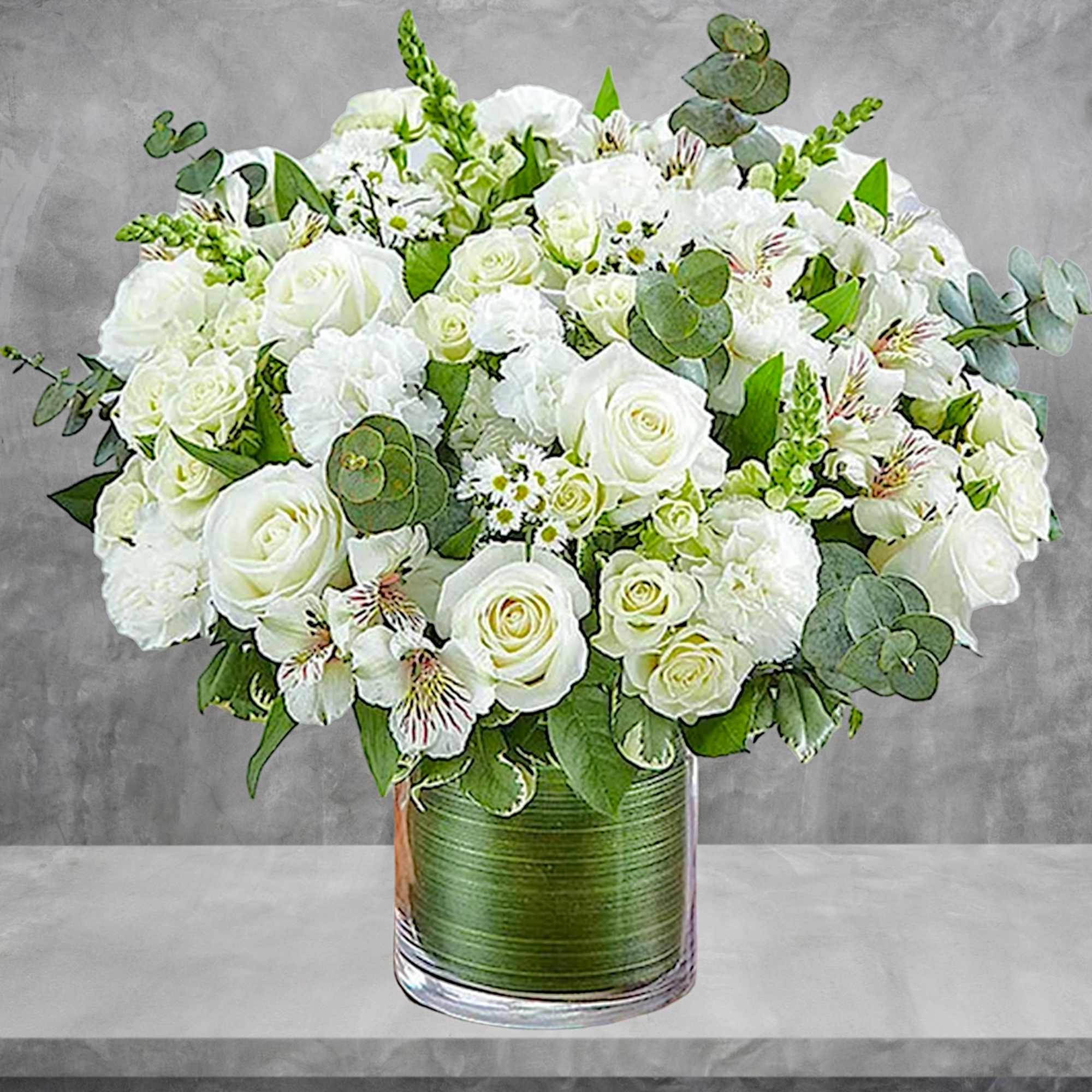 White roses and alstroemeria in a glass vase with eucalyptus, photo 4 of 6