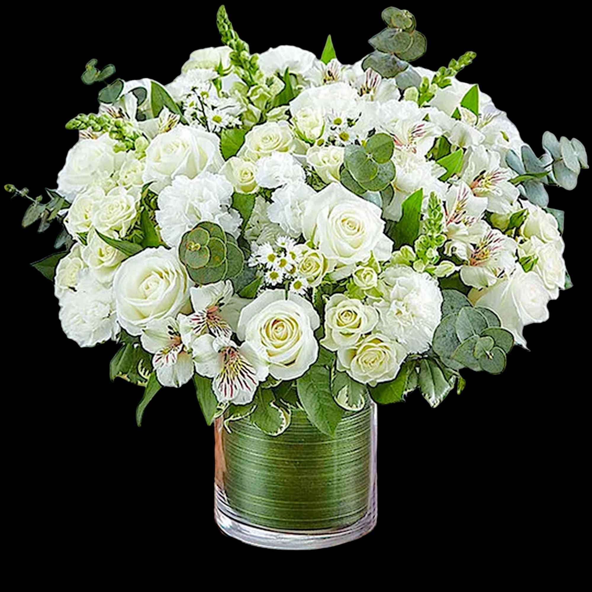 White roses and mixed white flowers in a glass vase