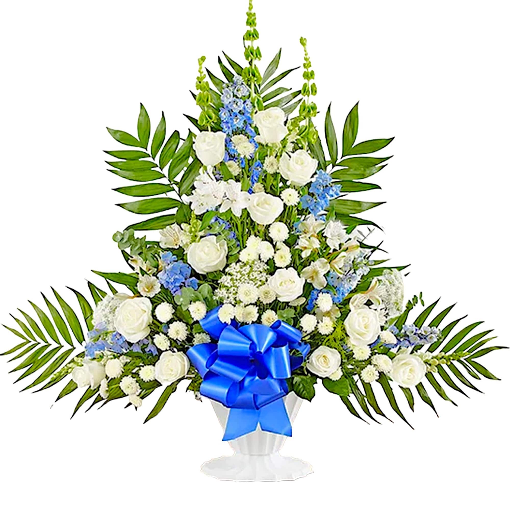 White and blue floral standing spray in a white urn with a blue ribbon