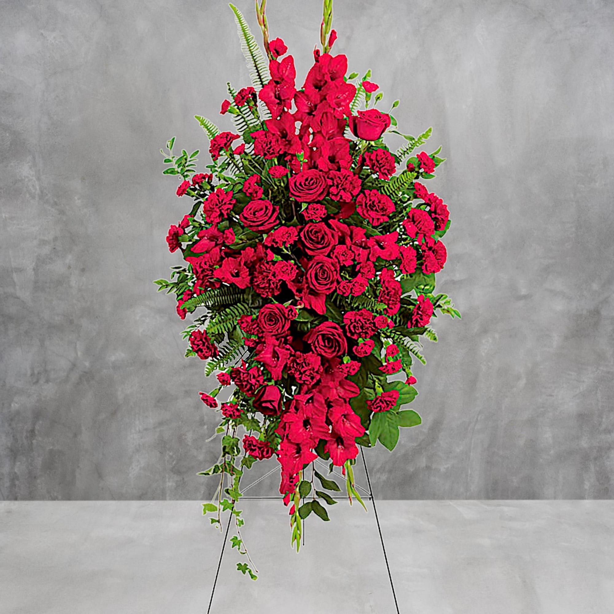 Tall red floral standing spray on a wire easel