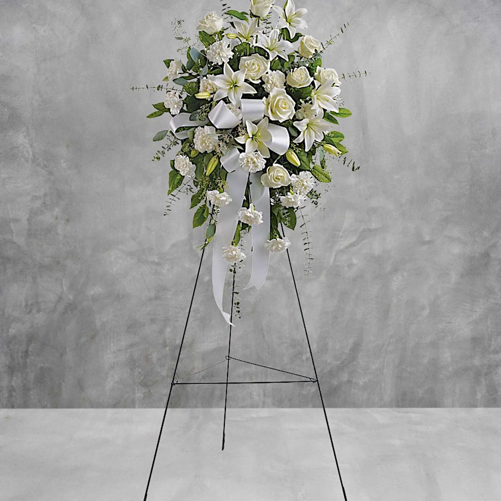 Stunning in its simplicity, this gorgeous spray of white roses, lilies and