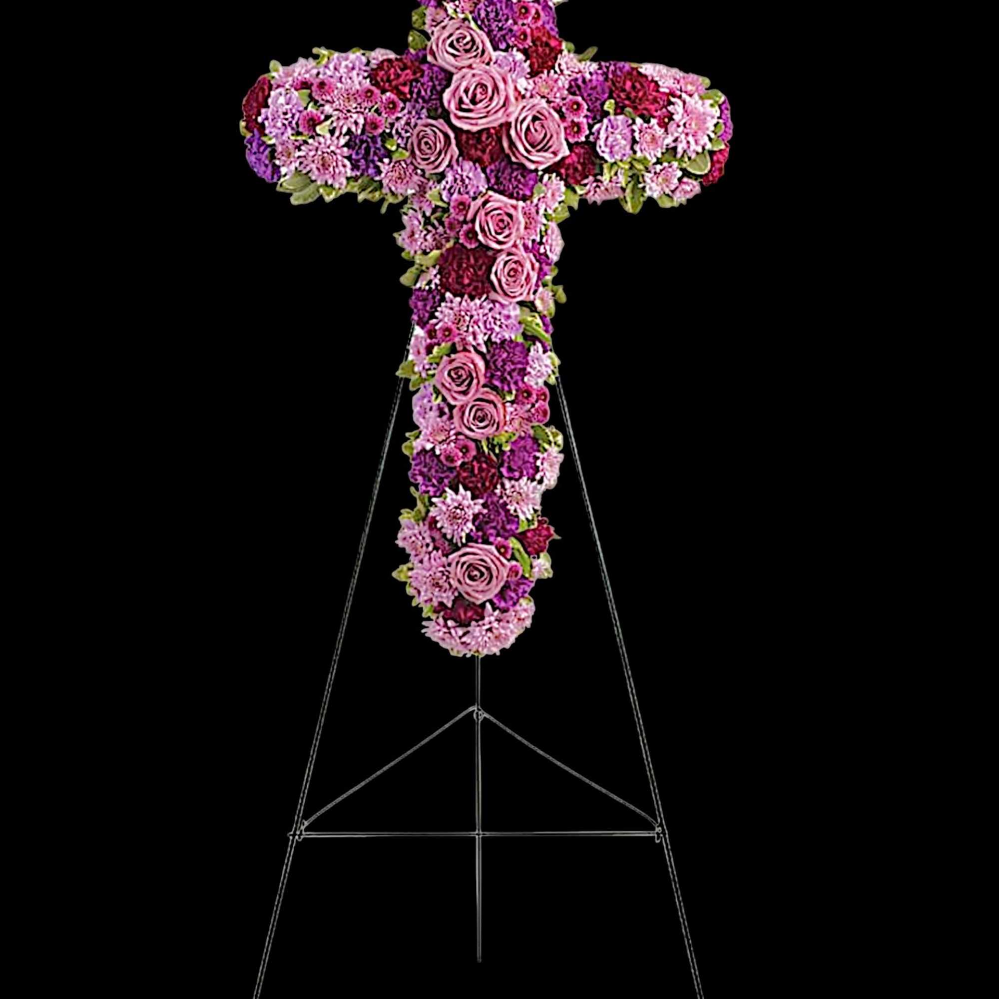 Pink and purple floral cross on a metal stand