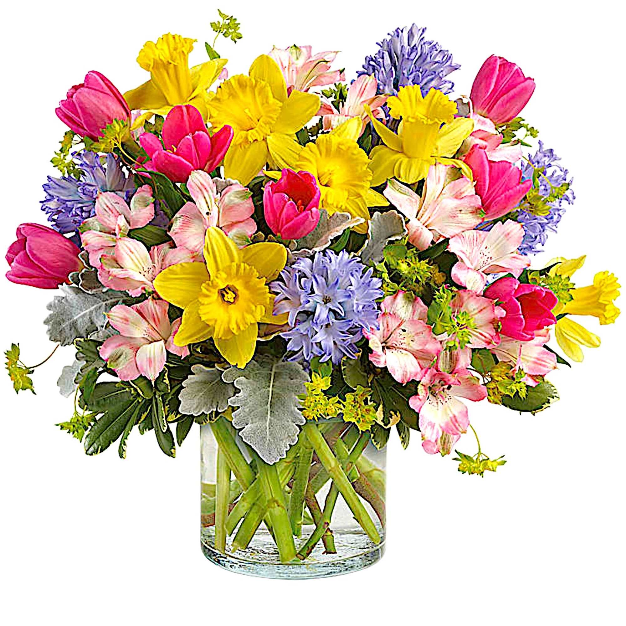 Colorful bouquet of tulips, daffodils, and alstroemeria in a glass vase