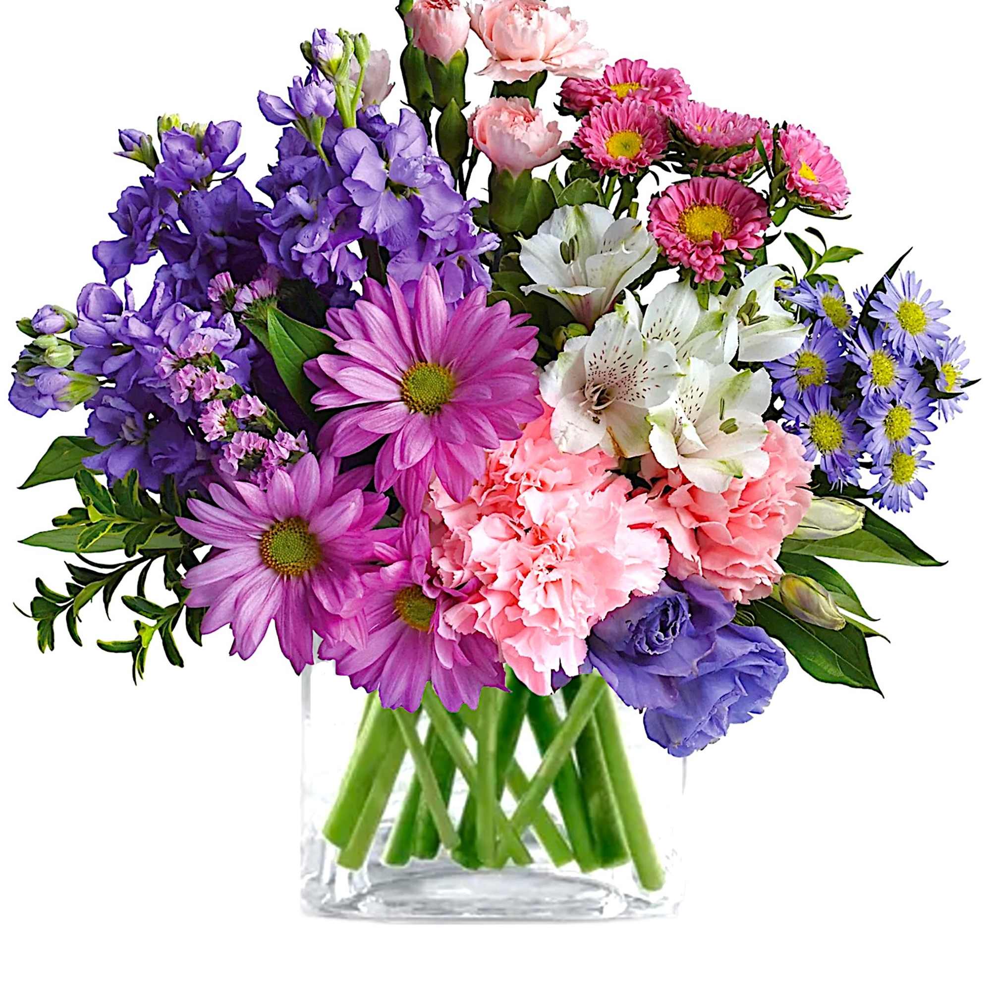 Mixed bouquet of purple, pink, white, and blue flowers in a clear glass vase