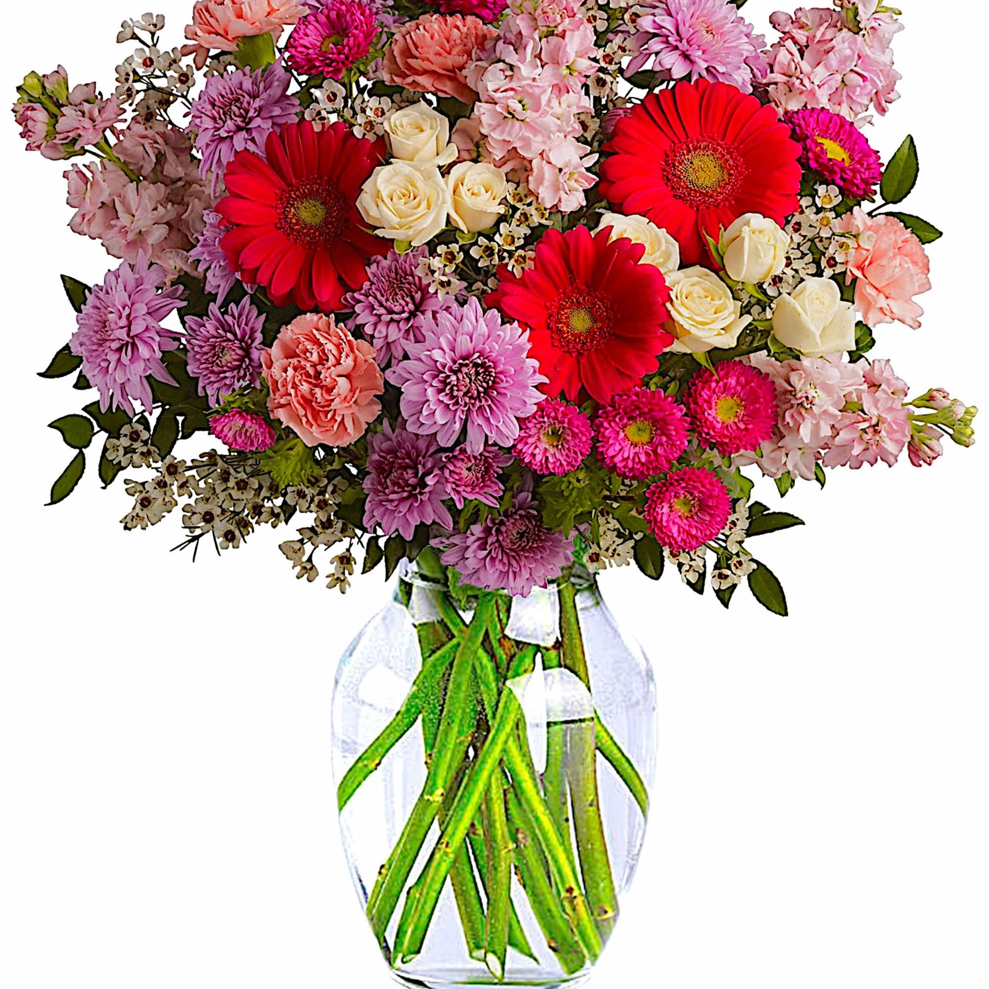 Mixed pink and red flowers in a clear glass vase