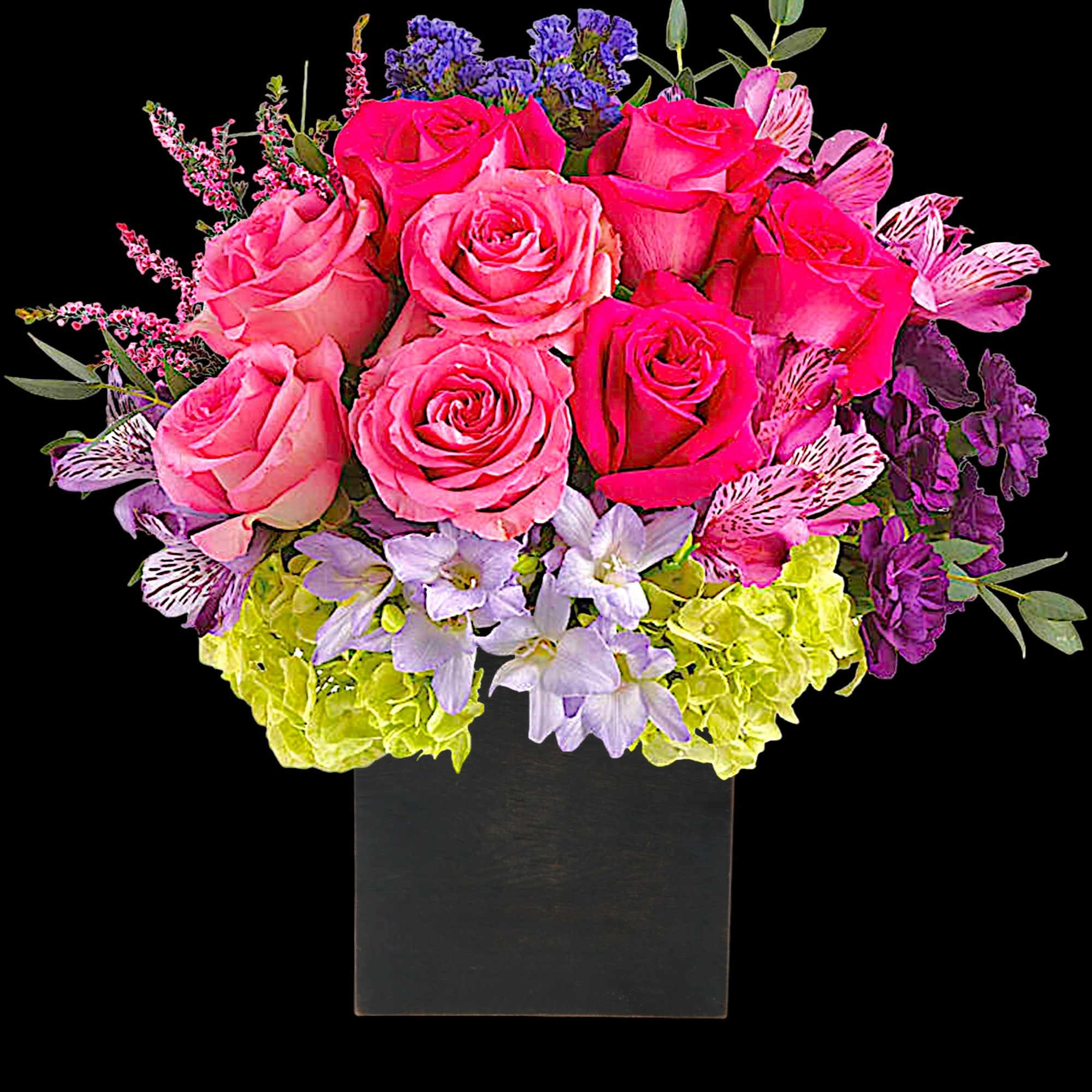 Pink roses and purple flowers arranged in a black square vase