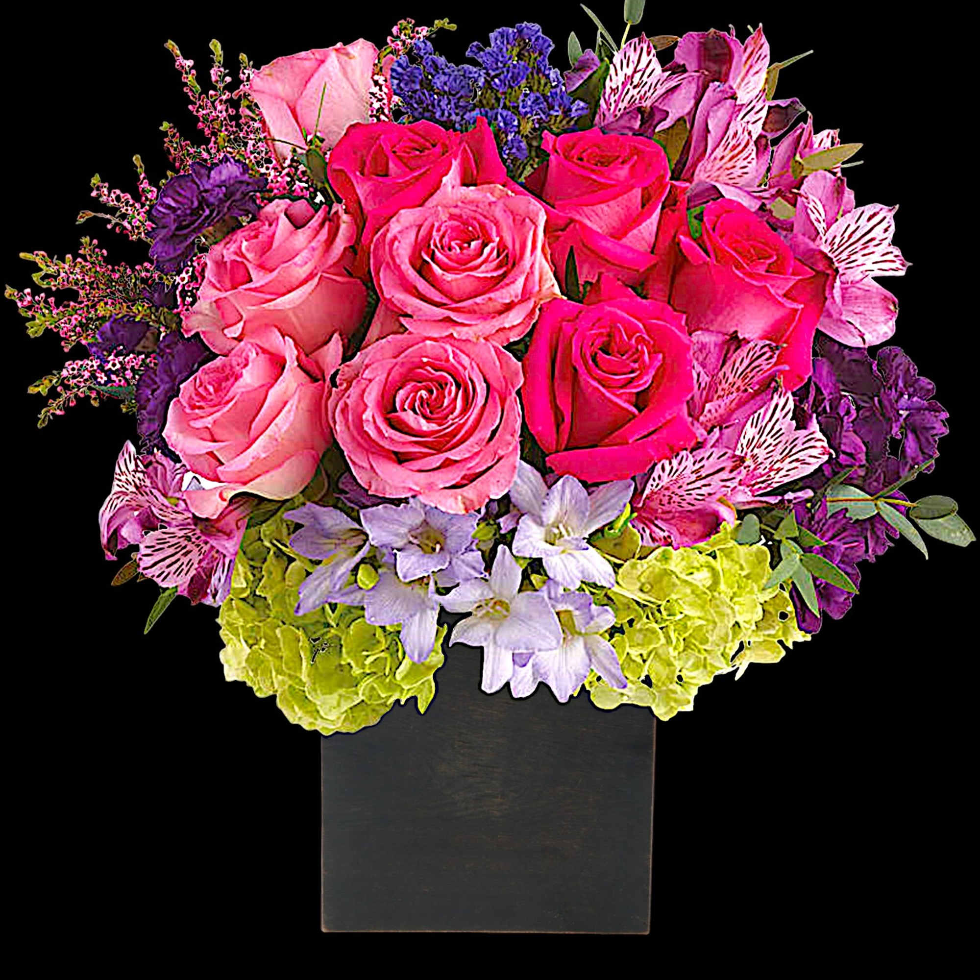 Pink and purple mixed bouquet in a black square vase