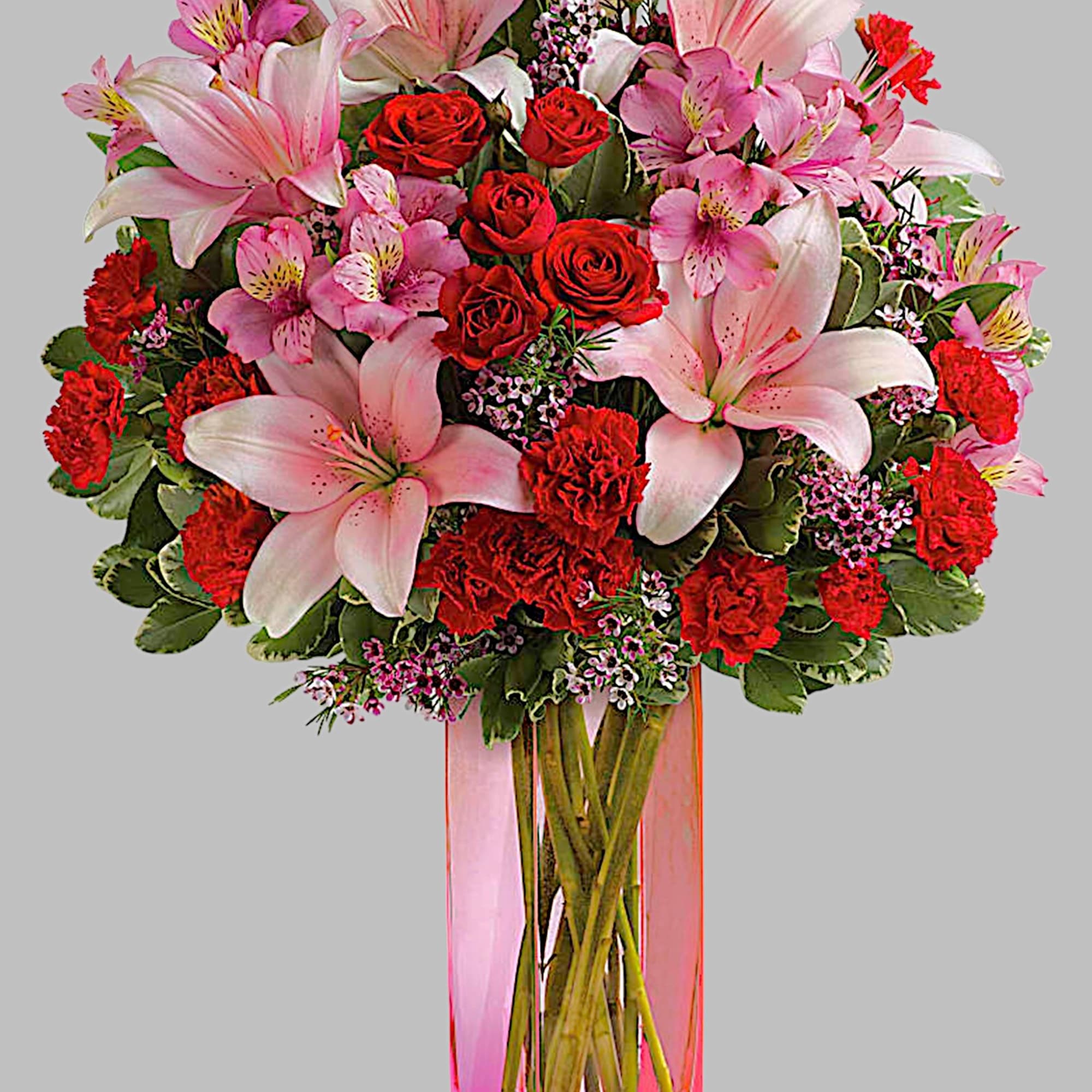 Pink lilies and red roses in a tall glass vase, photo 5 of 5