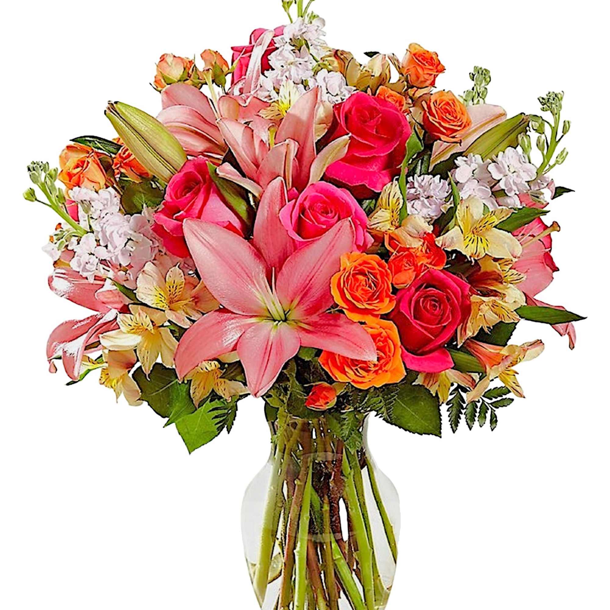 Bouquet of pink lilies and roses in a clear glass vase
