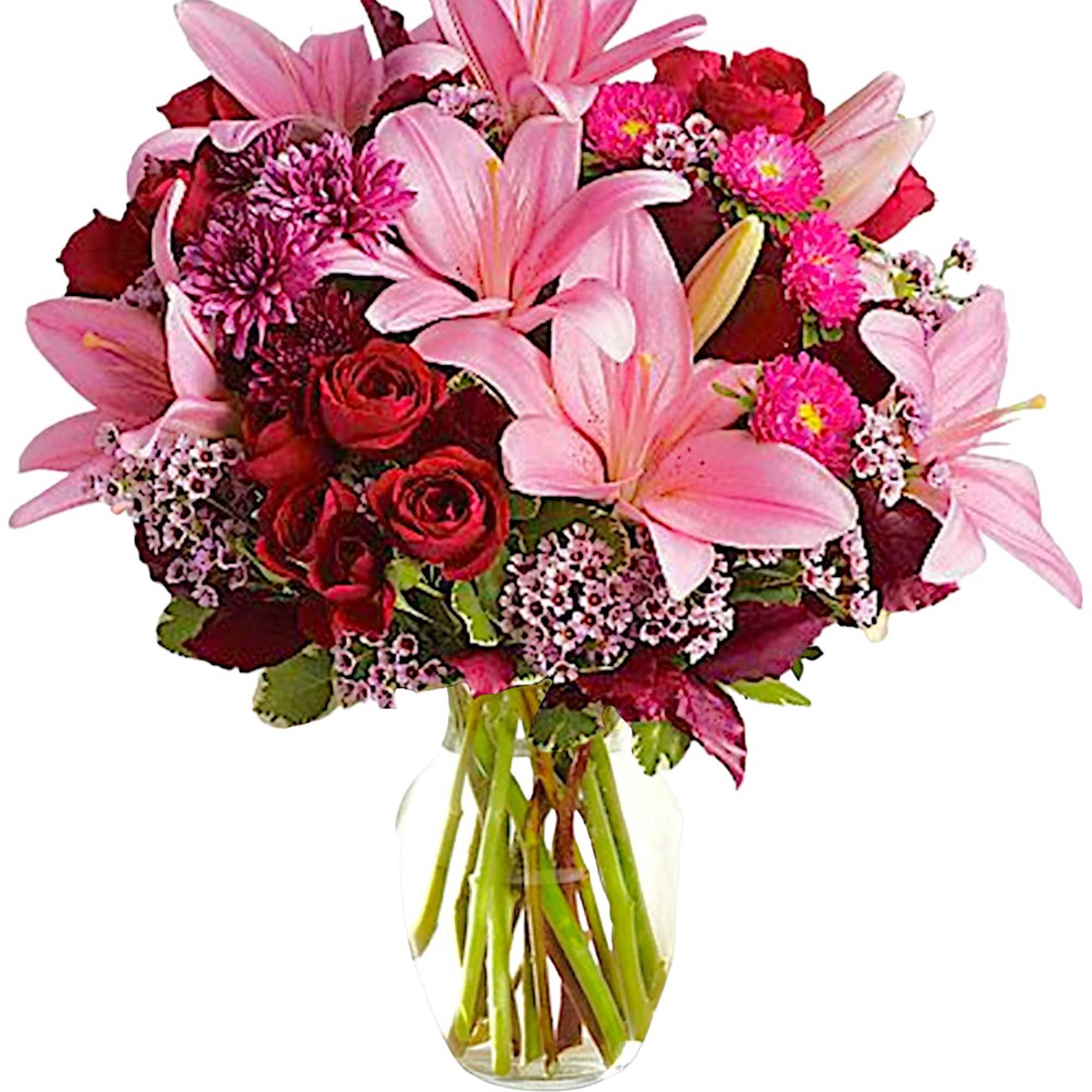 Bouquet of pink lilies and red roses in a clear glass vase