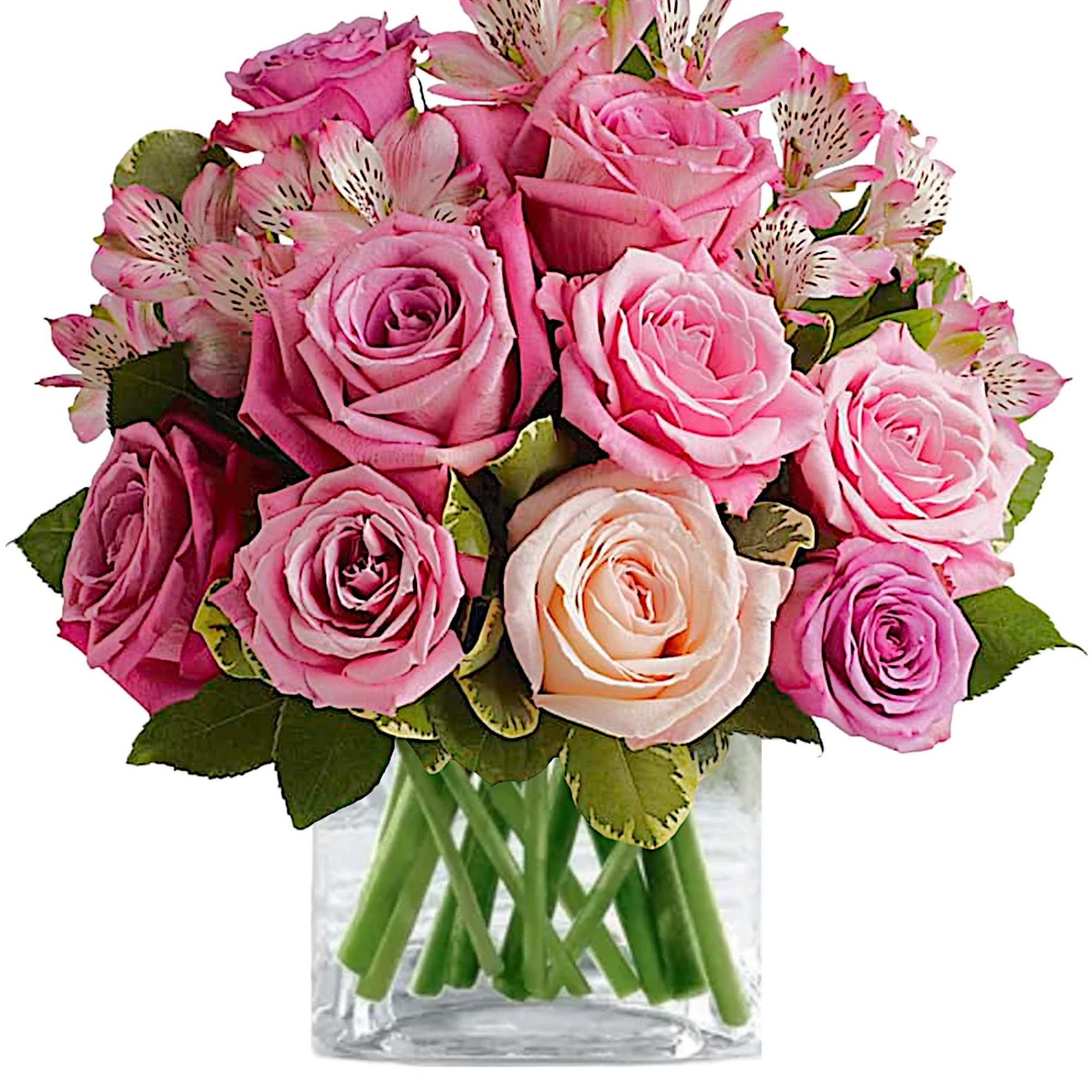 Pink roses and alstroemeria arranged in a clear glass vase