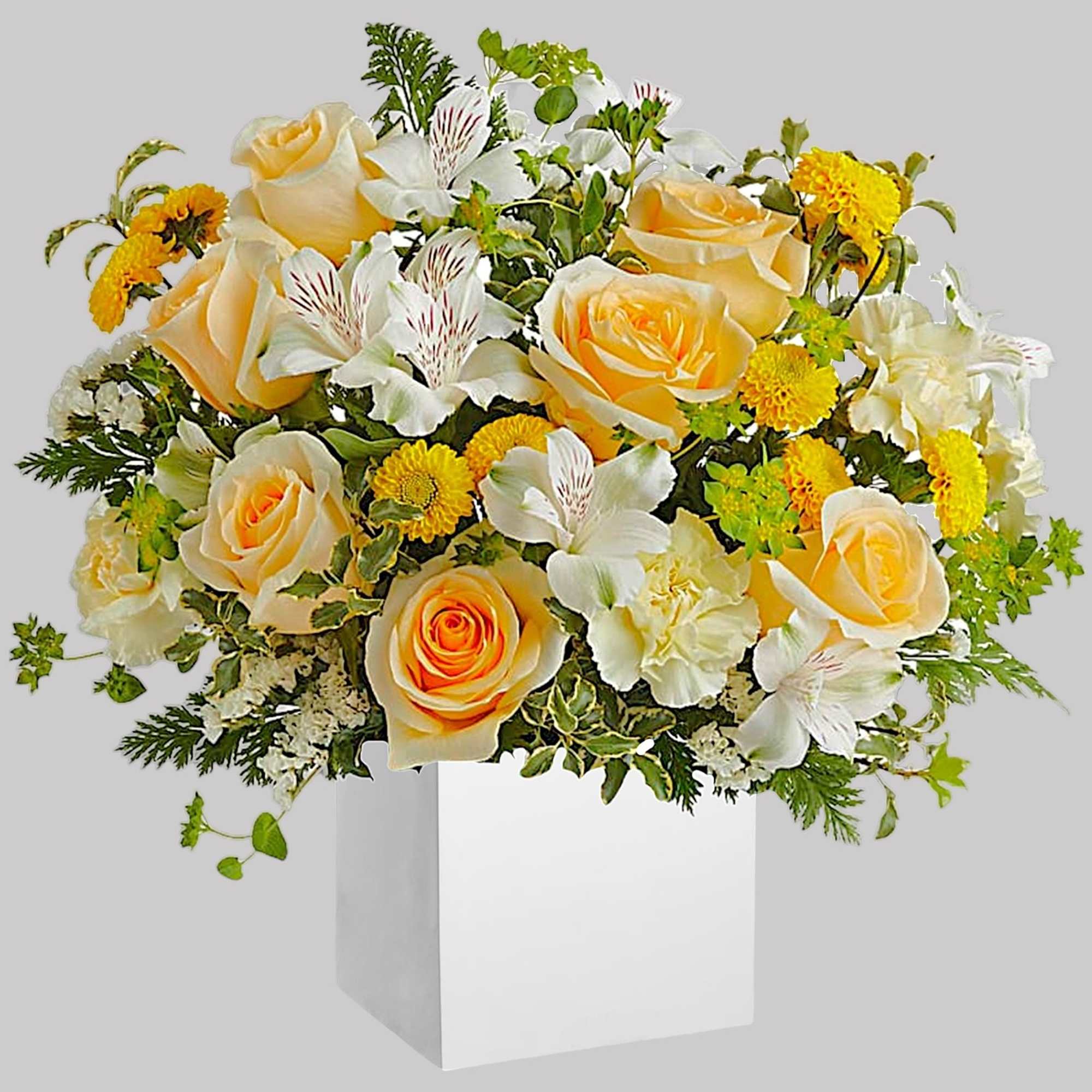 Bouquet of peach roses and white flowers in a white box