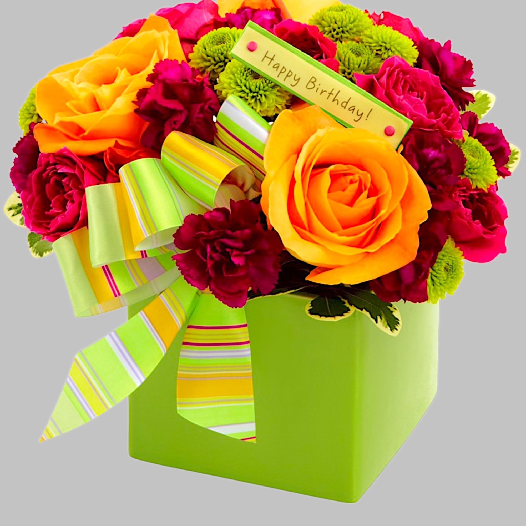 Bright birthday bouquet with orange roses and pink carnations in a green box