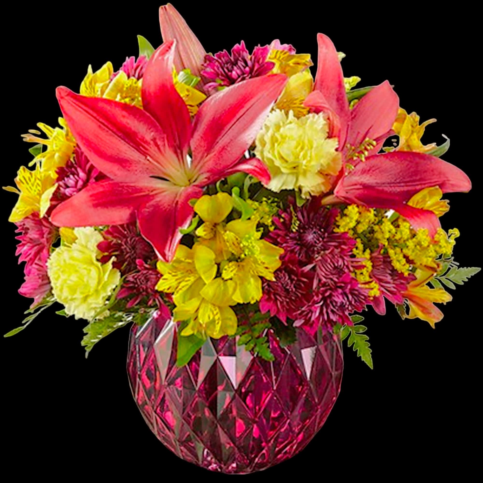 Pink lilies and yellow mixed flowers in a faceted pink vase