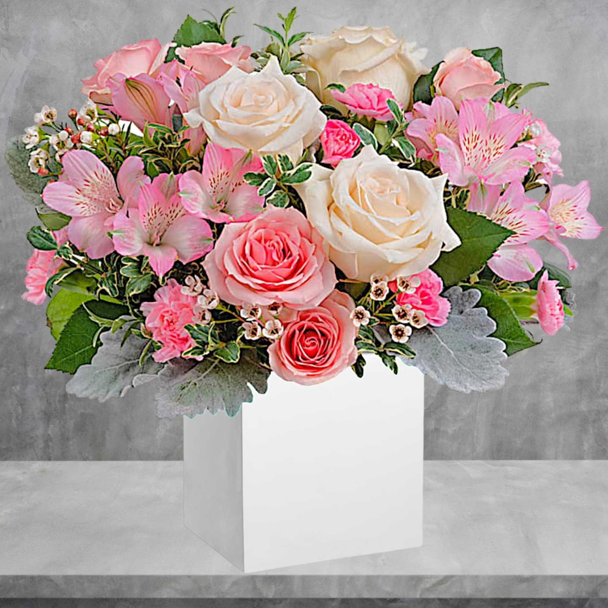 Pink and white rose bouquet with alstroemeria in a white box