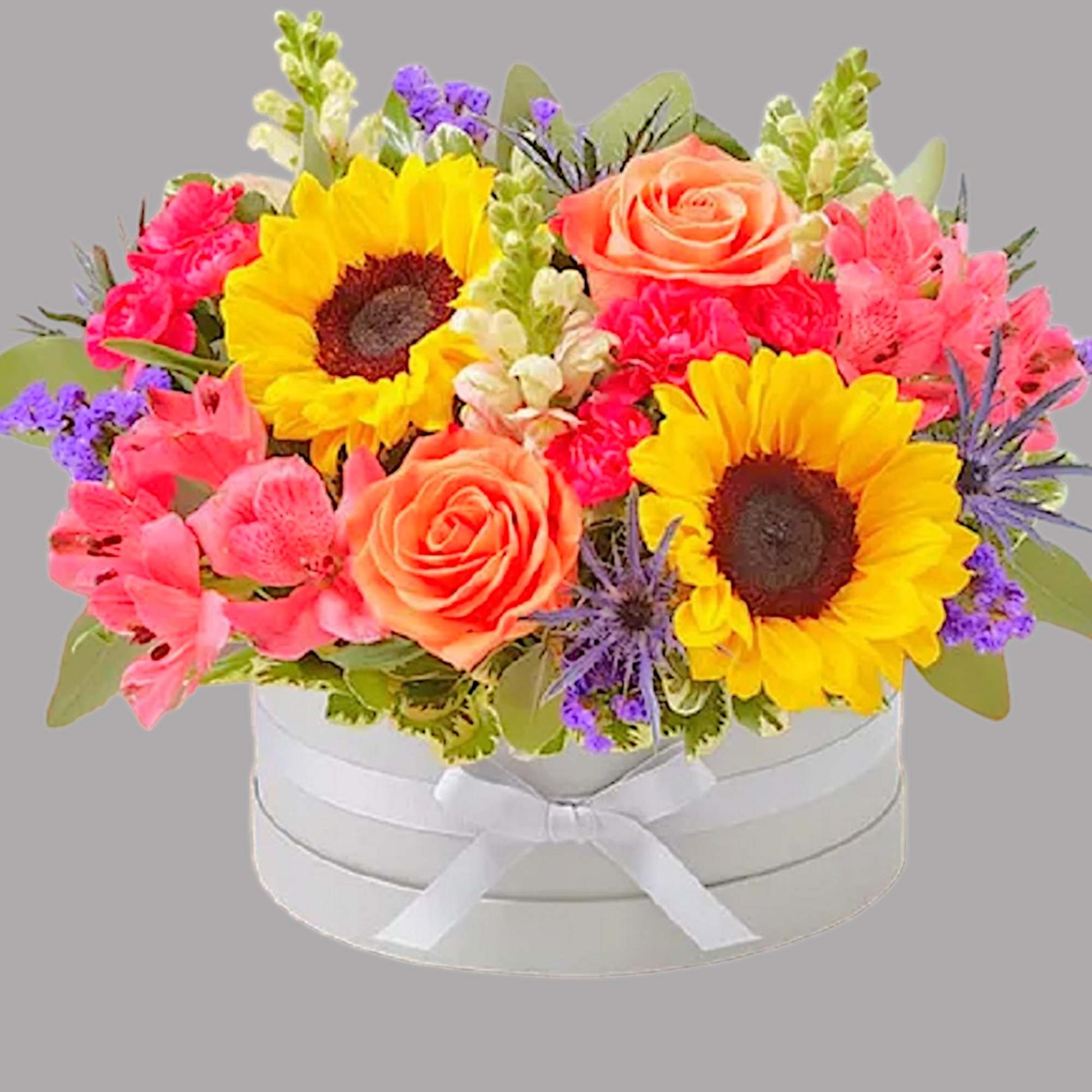 Bright mixed bouquet in a white round box with a ribbon, photo 6 of 11