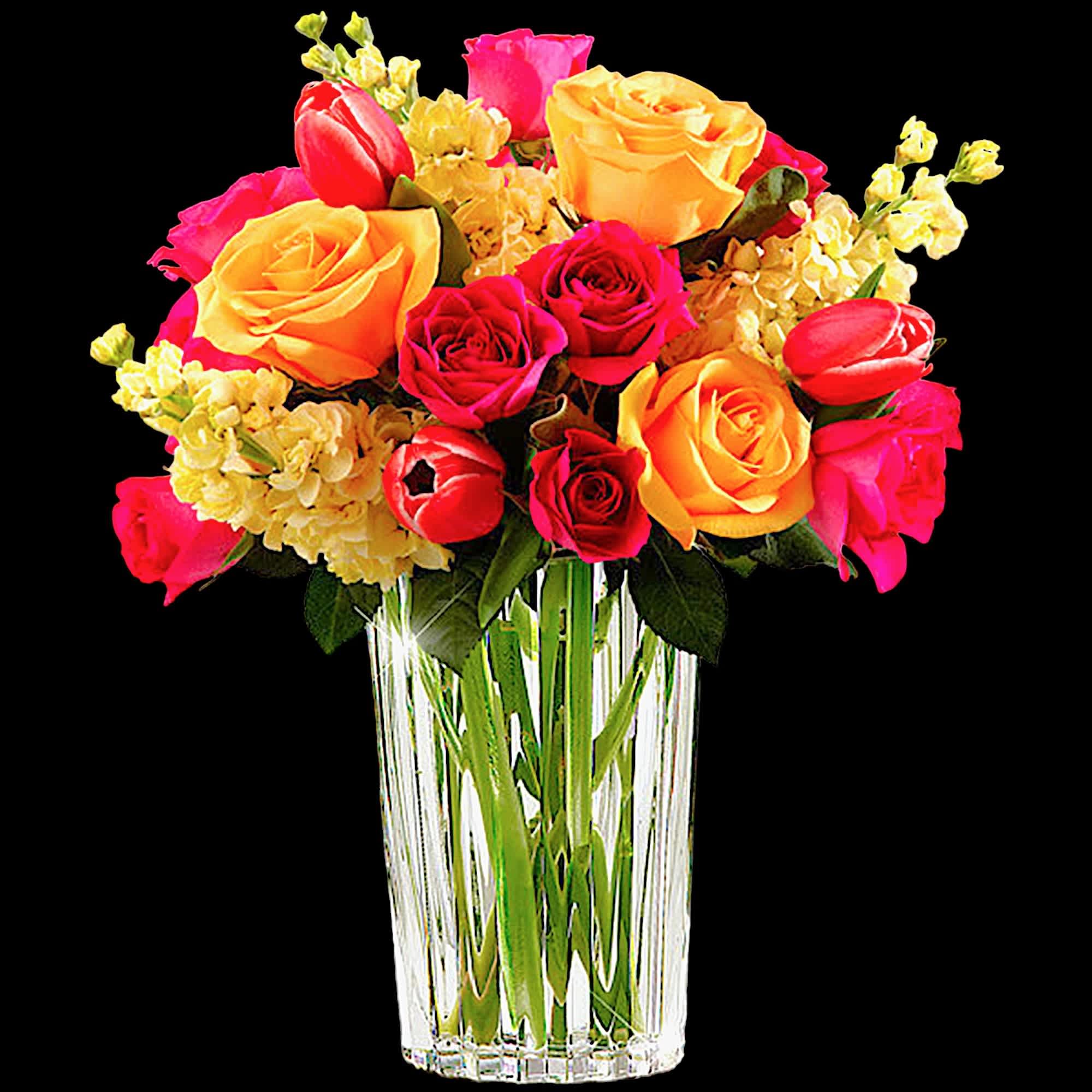 Bright mixed bouquet of roses and tulips in a clear glass vase, photo 4 of 5