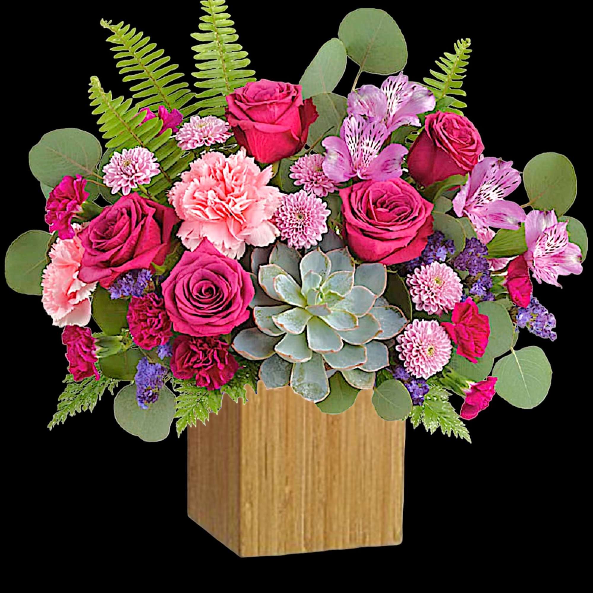 Pink roses and carnations arranged with succulents in a wooden box
