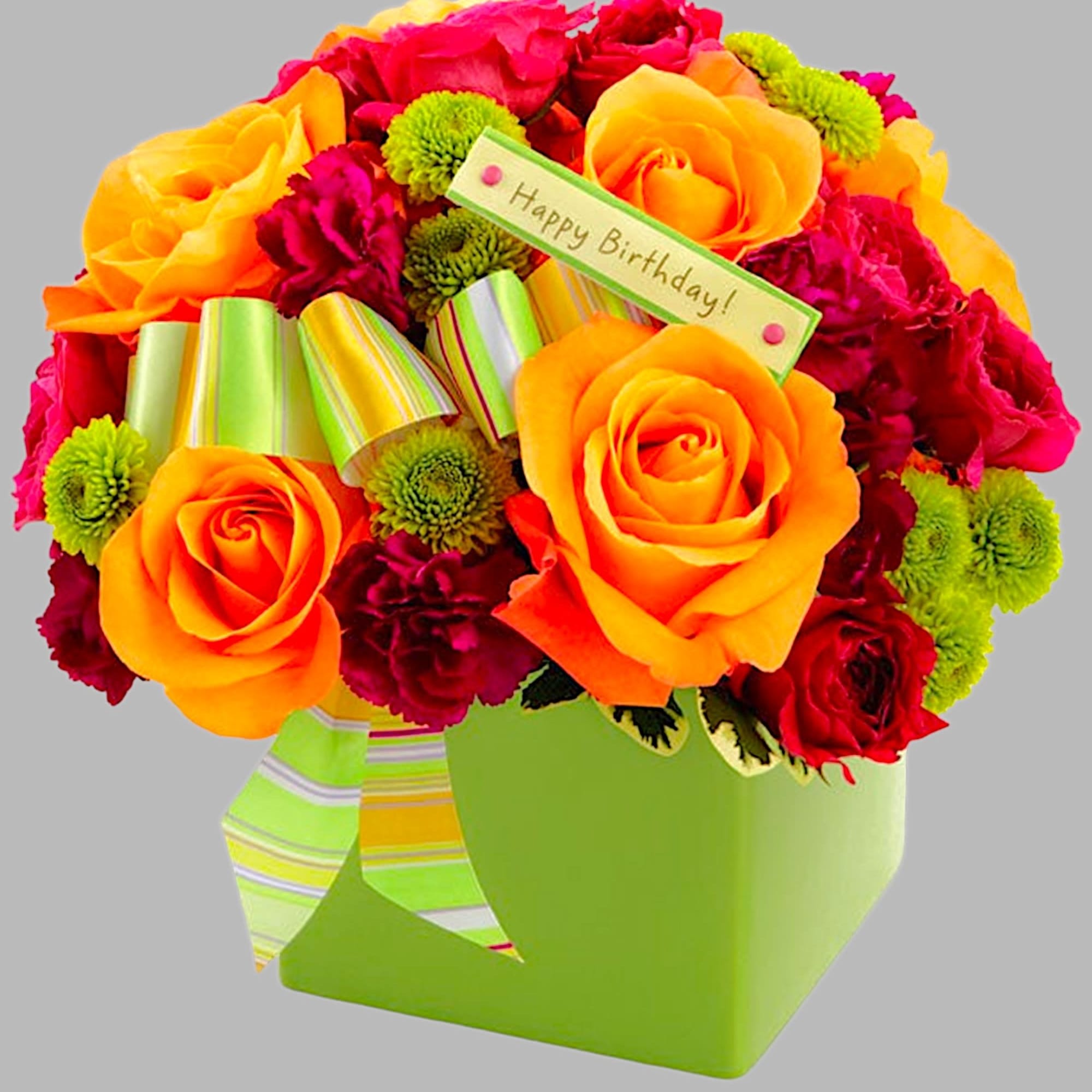 Bright bouquet of orange and red roses with a birthday tag in a green box
