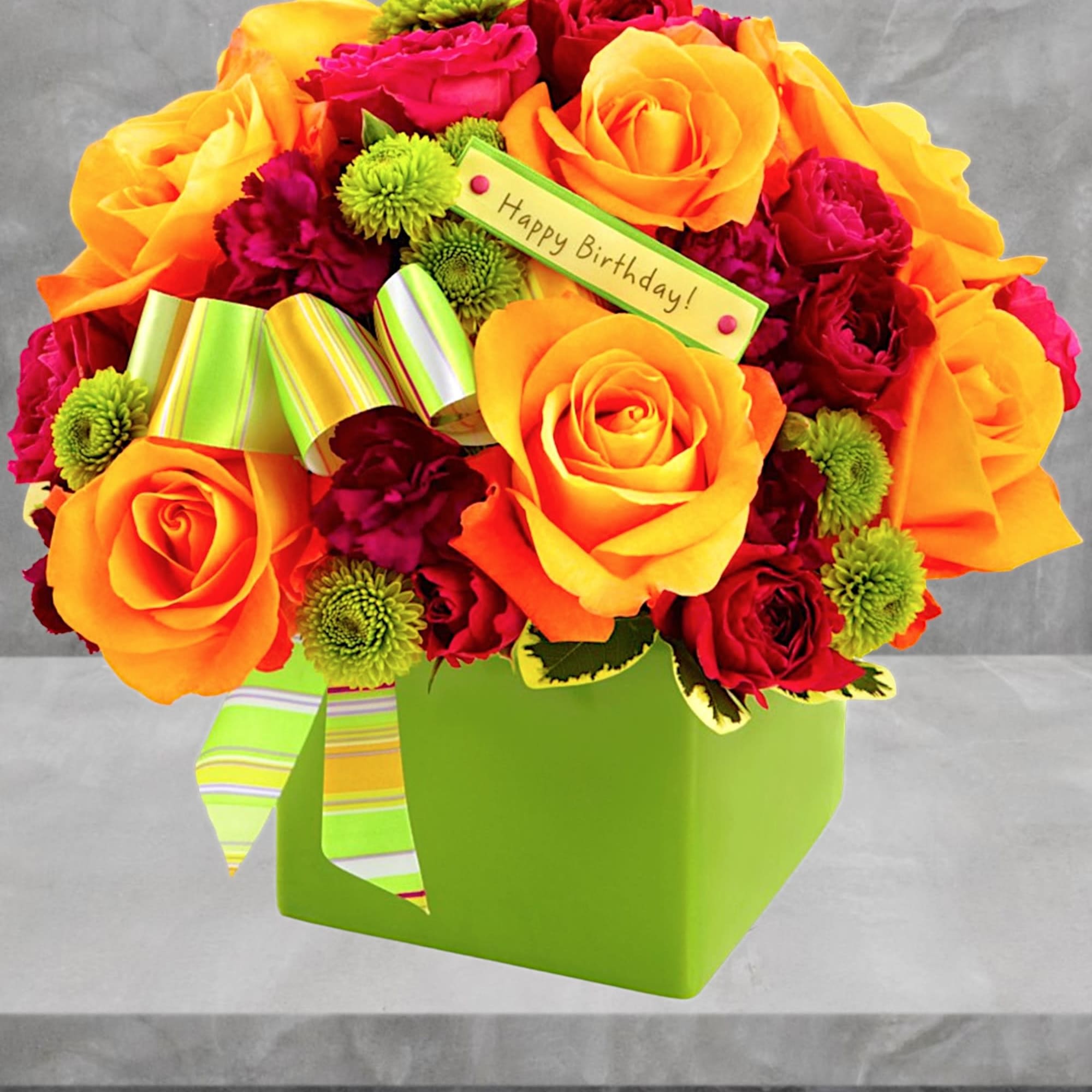 Bright bouquet of orange and red roses in a green box with a birthday tag, photo 2 of 4