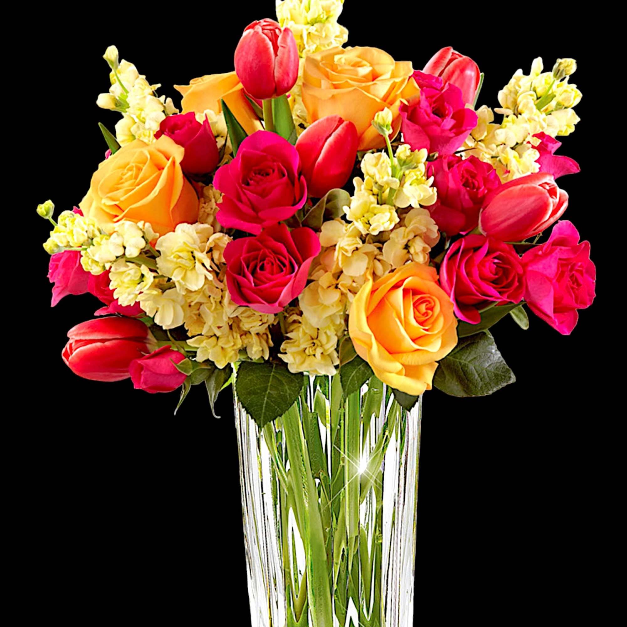 Bouquet of pink and yellow roses with tulips in a clear glass vase, photo 3 of 4