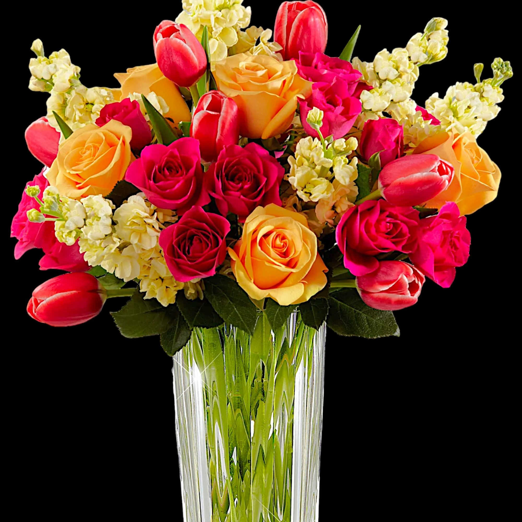 Bouquet of pink and yellow roses with tulips in a clear glass vase, photo 4 of 5