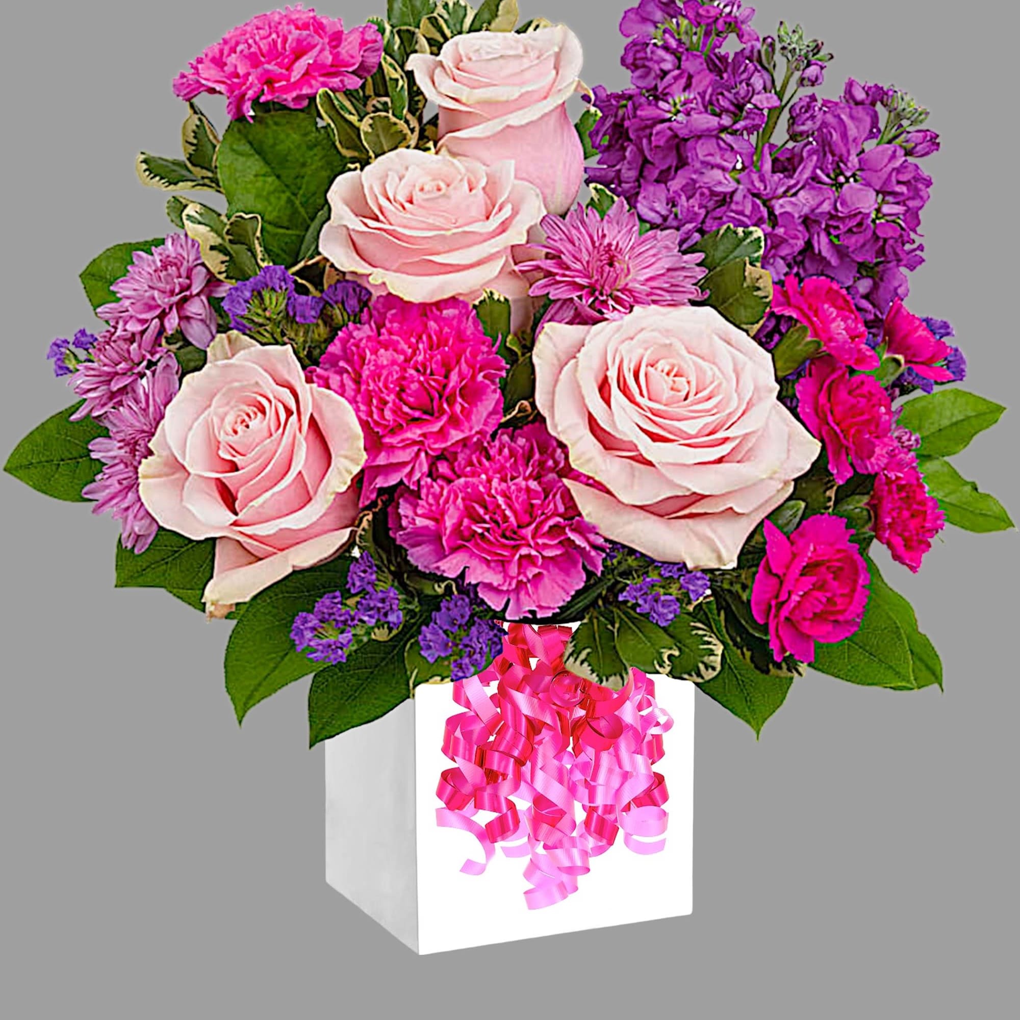 Pink roses and purple flowers in a white box with a pink ribbon bow