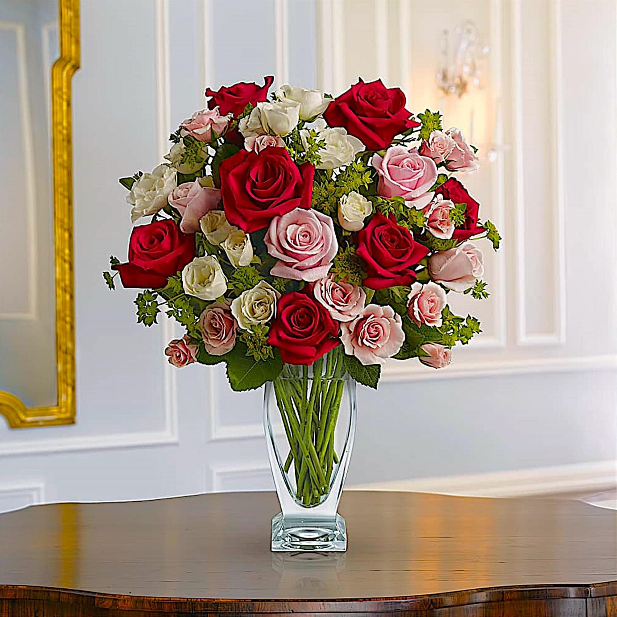 Bouquet of red, pink, and white roses in a clear glass vase, photo 2 of 5