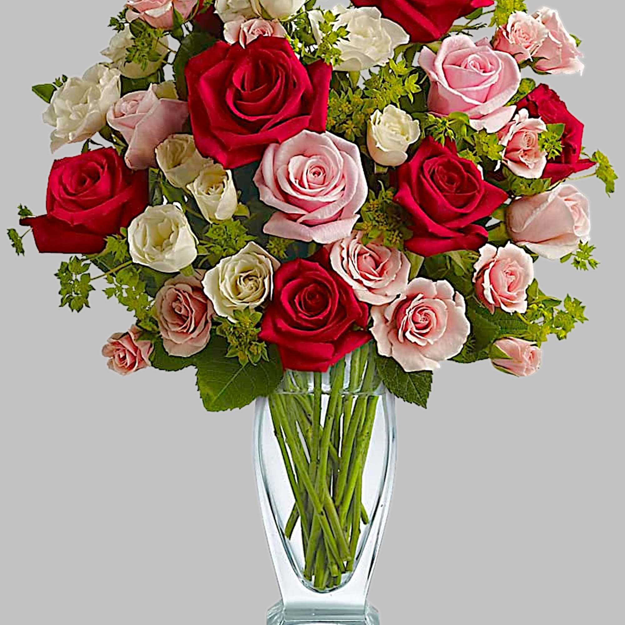 Bouquet of red, pink, and white roses in a clear glass vase, photo 5 of 5