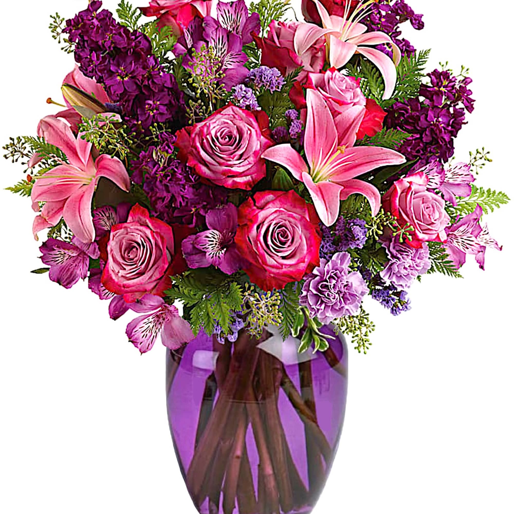 Pink and purple bouquet in a purple glass vase