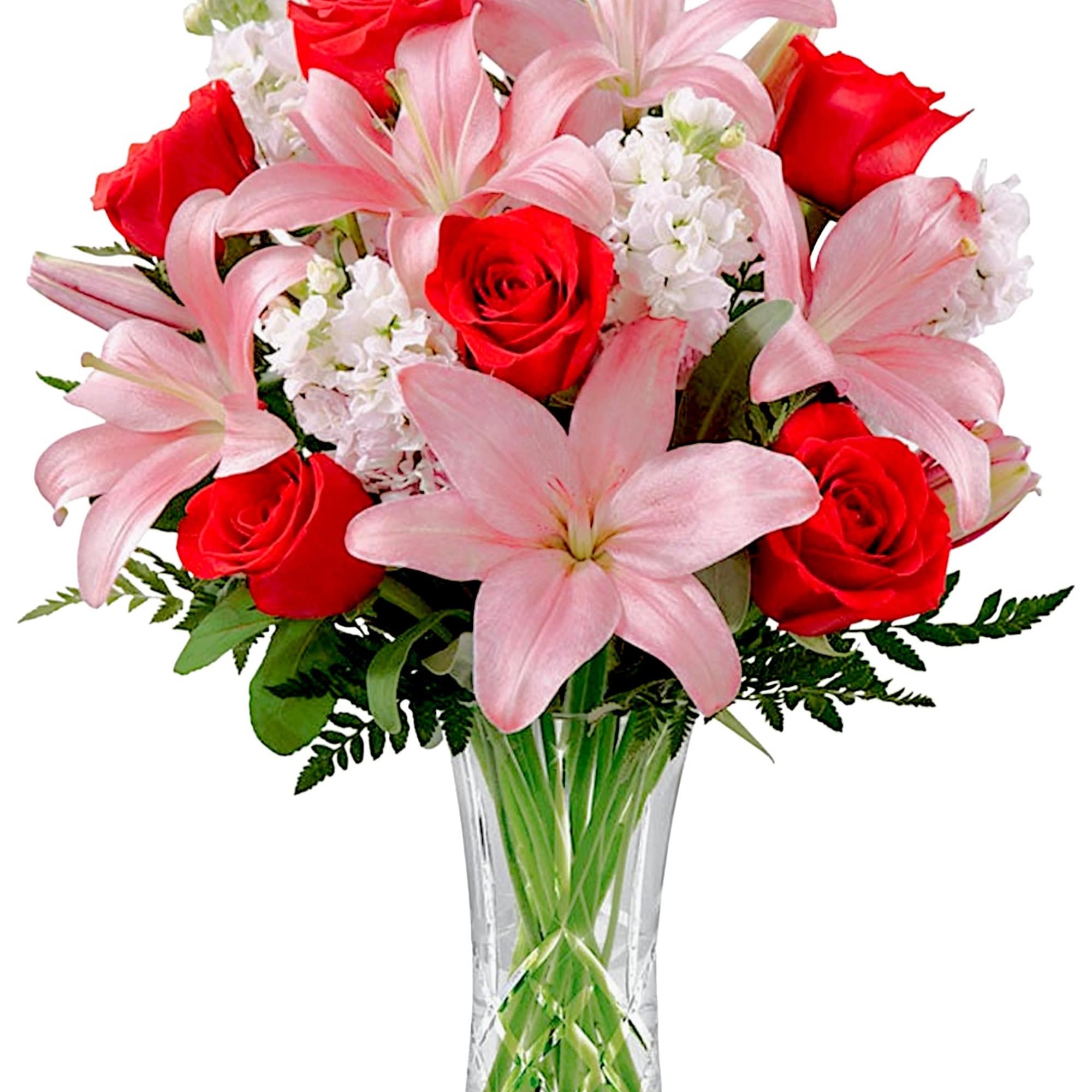 Bouquet of pink lilies and red roses in a clear glass vase