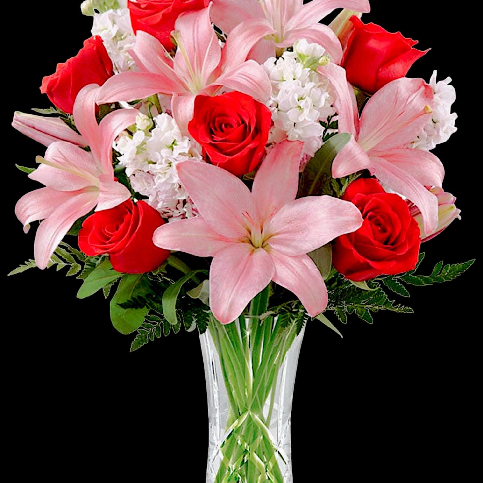 Pink lilies and red roses arranged in a clear glass vase, photo 3 of 4