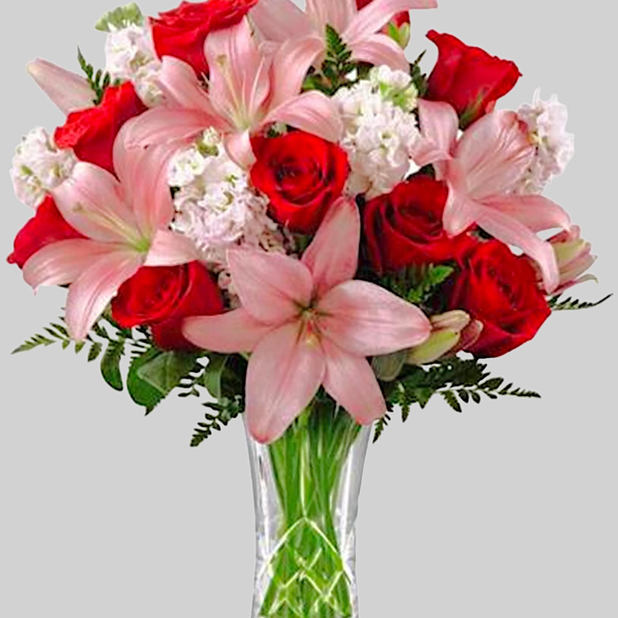 Bouquet of red roses and pink lilies in a clear glass vase, photo 4 of 4