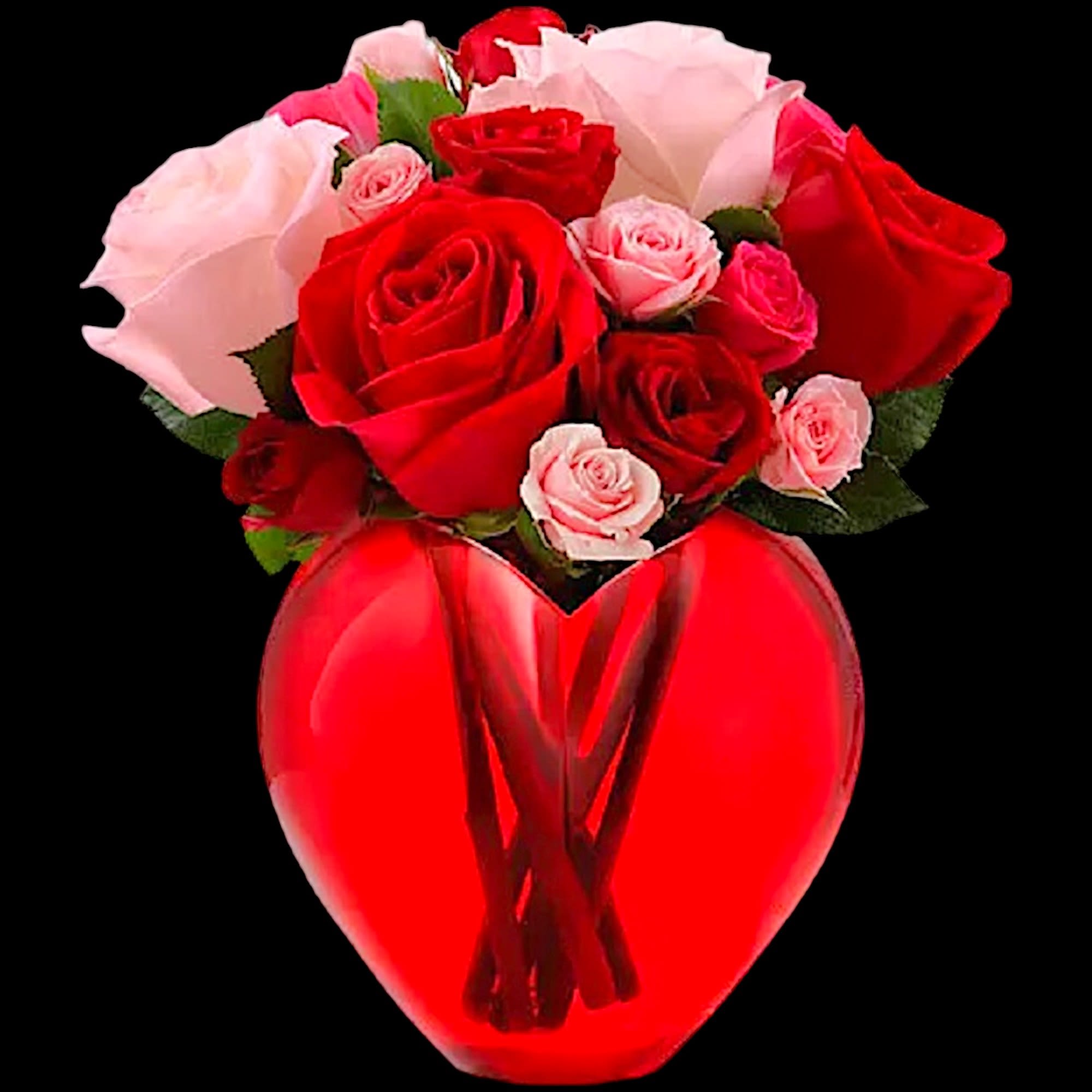 Red and pink roses arranged in a heart-shaped red vase