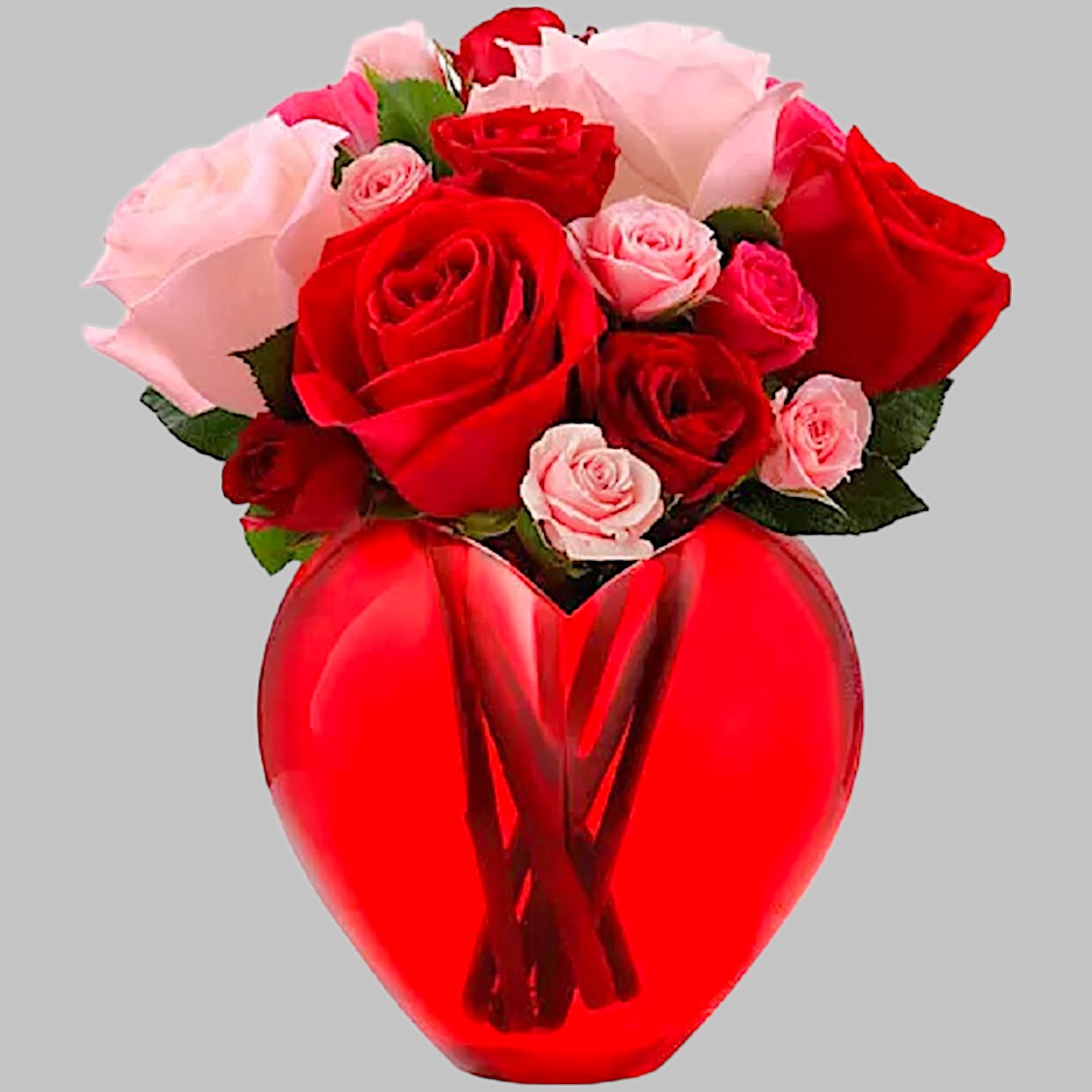 Bouquet of red and pink roses in a red heart-shaped vase
