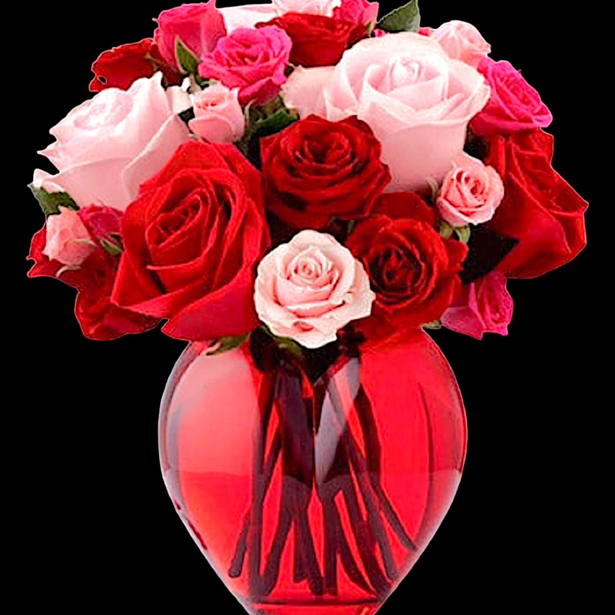 Bouquet of red and pink roses in a clear glass vase